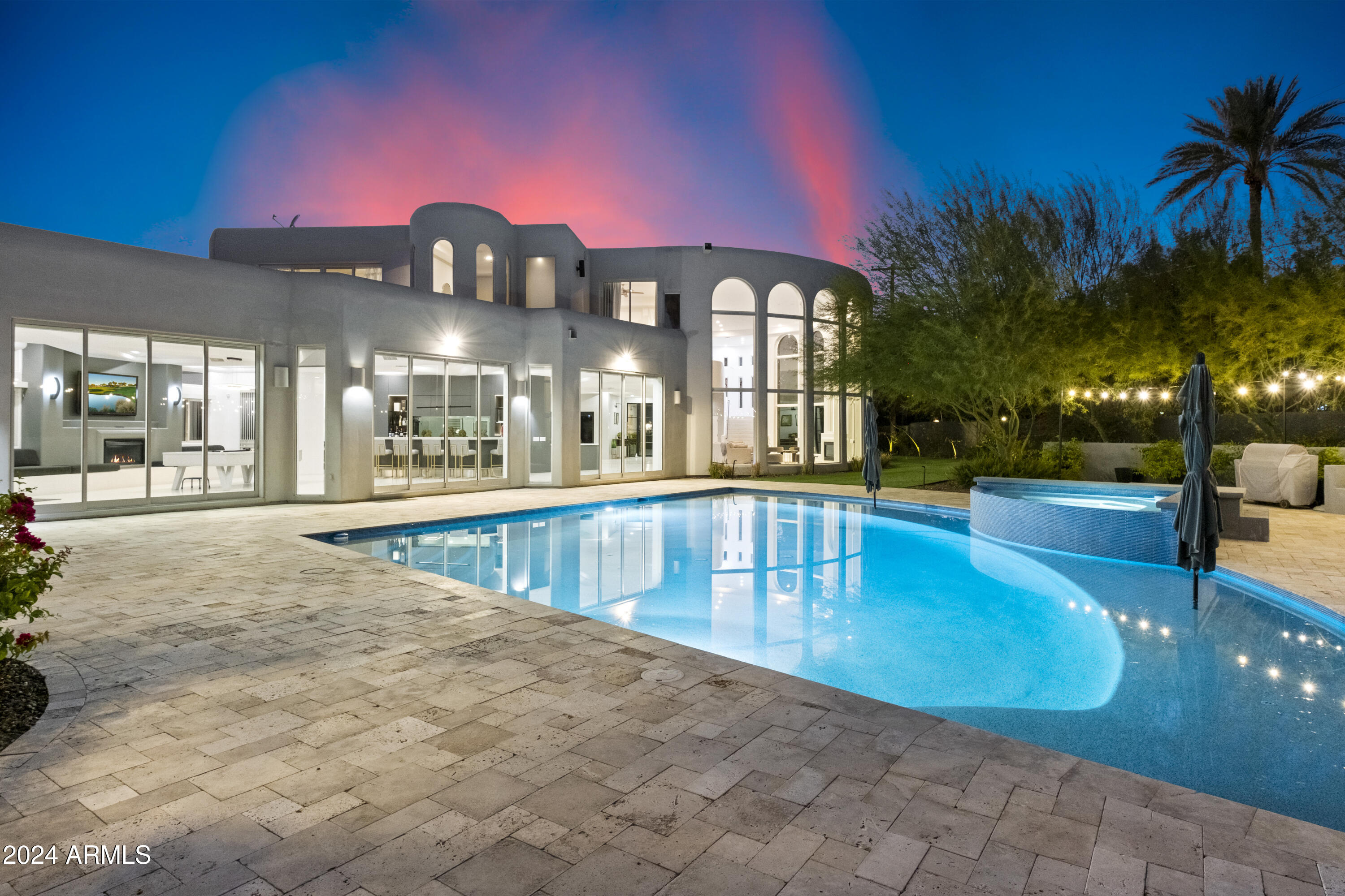 Exceptional Value!  This stunning  estate in Paradise Valley combines luxury, privacy, and breathtaking views of Camelback and Squaw Peak mountains on one acre! Privately gated includes TWO HOMES with a total of six bedrooms. The main residence boasts an impressive open floor plan reflecting a blend of refined coastal elegance and contemporary architectural design.  An entertainer's dream, this property has been crafted with attention to detail, featuring a chef's kitchen with high-end appliances, and a marble bar with a built-in aquarium.  Conveniently located near scenic biking trails, and only a short drive from Biltmore's upscale dining and shopping. Great for family or entertaining.