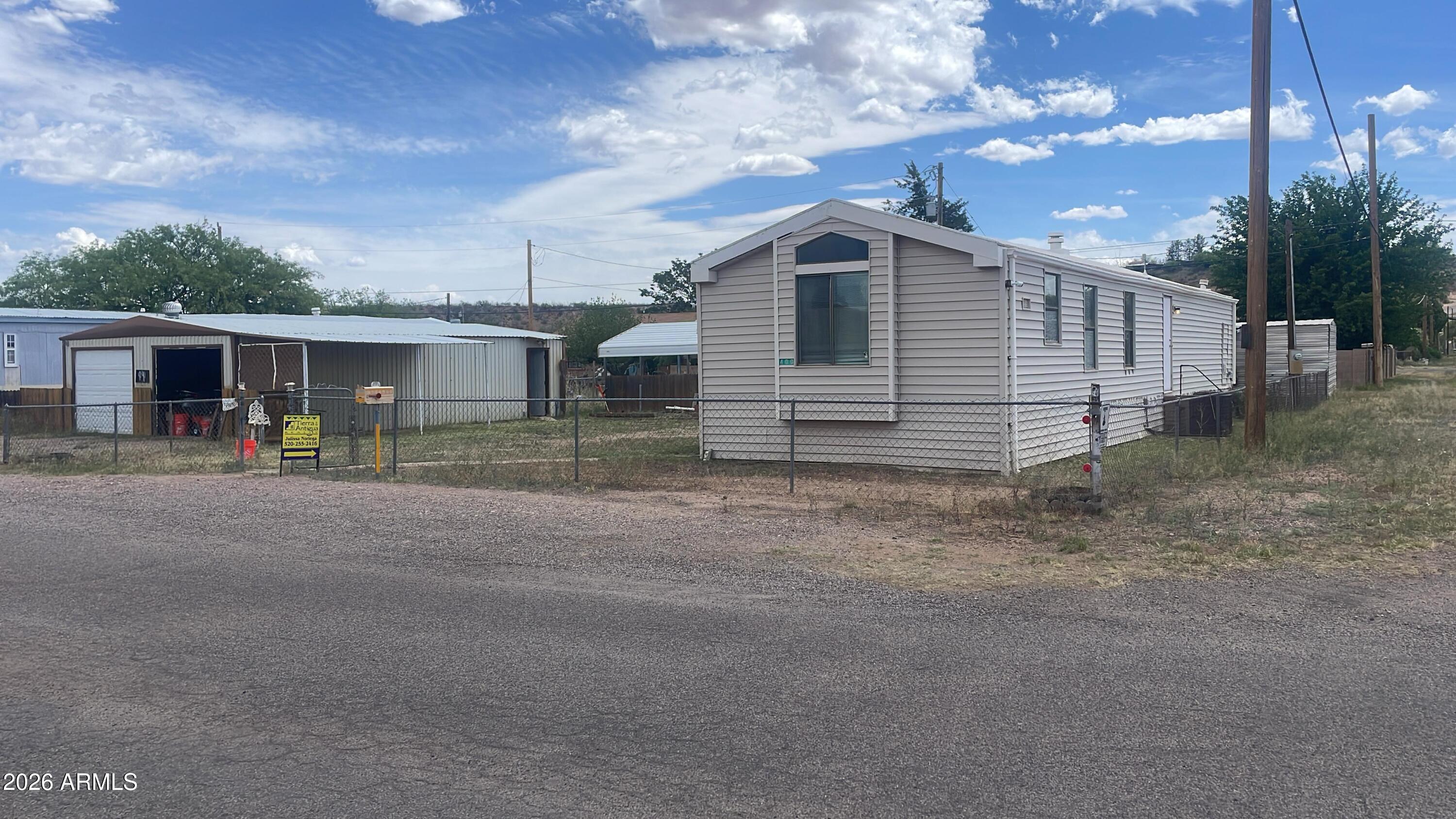 Charming two bedroom two bathroom manufactured home in Huachuca city offering 1,024 sq ft of living space, this home is a functional layout, spacious bedrooms and great potential conventionally located with easy access to nearby amenities seller recently installed the 40 amp, 220 EV charger station in 2024 professionally installed by a licensed electrician located in the garage perfect for electric cars. Perfect opportunity for first time, buyers buyer investors or those looking for a cozy home at affordable price sitting on two lots. The garage 36' x 24' and the carport size 18' x 18'
The refrigerator comes with the home as well.