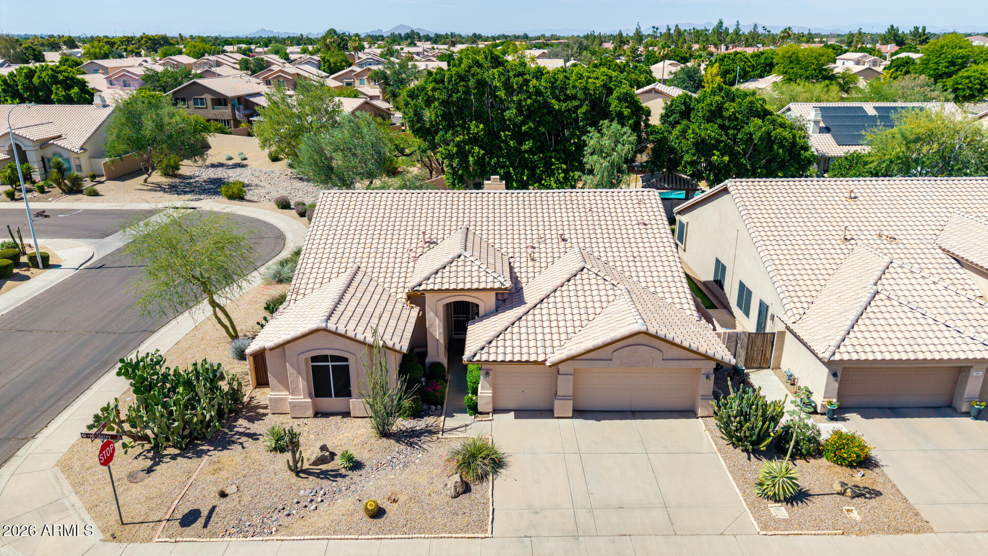 WOW! Beautifully maintained, spacious, impressive high vaulted ceilings & lots of storage. TW Lewis quality-built home owned by the original owner! Single level, split floor plan with 4 bedrooms, 3 car garage & pool/spa on a private corner lot! All the big expense items are done. Roof (2016), Electrical Panel (2024), Pool plaster (2020), 2 A/C (2012 and 2022), plus for technology people that need a server room or if you run hot--a mini-split for one room (2020). If the garage is your thing--cabinets galore & an epoxy coated garage floor. Enjoy the sparkling heated pool & spa, huge covered patio & grassy play area in the private back yard. The low maintenance front yard overlooks the park area maintained by the HOA. Close to freeways, a wonderful Chandler Park, Intel and more.