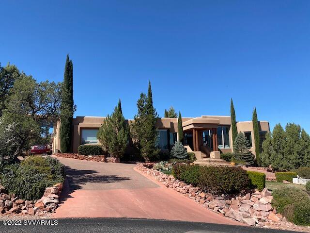 This is an Awe inspiring single level estate on almost 1 acre in West Sedona. Panoramic Views of the  Red Rocks. 18' ceilings with 16' floor to ceiling windows. New marble floors in the Great Room and Kitchen with in-floor radiant heat. A Chef's dream kitchen with Wolf Range and Sub Zero Refrigerator.
Main house has phenomenal views out most windows!

Master Bedroom with Amazing Red Rock Views, Fireplace and two custom closets.
Master bath has a high quality steam shower! 

Outdoor living with built in BBQ, Covered patio with shade screens. Pool, fireplace,
raised garden beds and several fruit trees.

Guest casita is a One bedroom one bath with kitchen and laundry.

So many upgrades. Too many to list.  This estate is a must see!