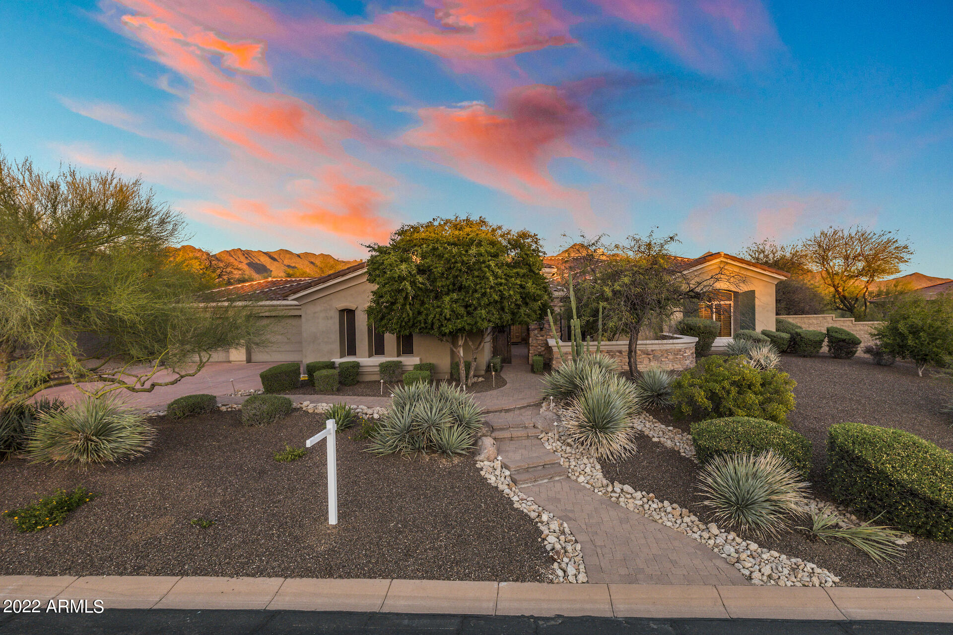Refreshed & breathtaking! Entertainer's delight! Enter through private courtyard w raised herb bed & lime tree. Enter to soaring ceilings throughout on this King & Queen build! Montery homes construction sitting on one of the best lots behind the private gates of beautiful La Strada!. Backs to natural wash & breathtaking McDowell mountain views. 6,000 sq ft of high-end luxury in the best Scottsdale location! Owned solar, heated pool, game room, wet bar, wine cooler, office, theater room & open floor plan are just dynamite! All en-suite beds w walk in closets are split from Master retreat. Enjoy the year with weather perfectly suited for indoor/outdoor living with side & back patios that allow for seamless transitions.Patio misters & fire pit area across a statement-piece bridge in backyard