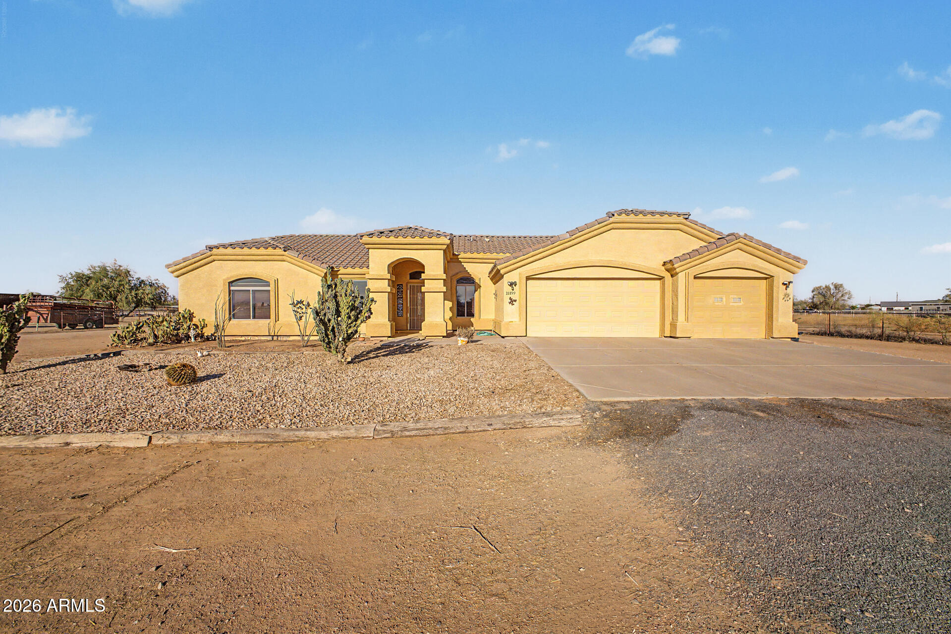 Discover wide-open space and comfortable living in this 3-bedroom home with a den, set on 1.3 acres with room for horses, toys, and future additions. Vaulted ceilings and a great room layout create an airy. The U-shaped kitchen offers ample cabinet and counter space, a breakfast bar and a bright eat-in area overlooking the property. The spacious primary suite features a private exit to the back patio, plus a full bathroom with separate tub and shower, double vanity, and a generous walk-in closet. Enjoy outdoor living under the large covered patio--perfect for quiet mornings or entertaining with mountain views in the distance. A 3-car garage and fresh interior paint complete the package.