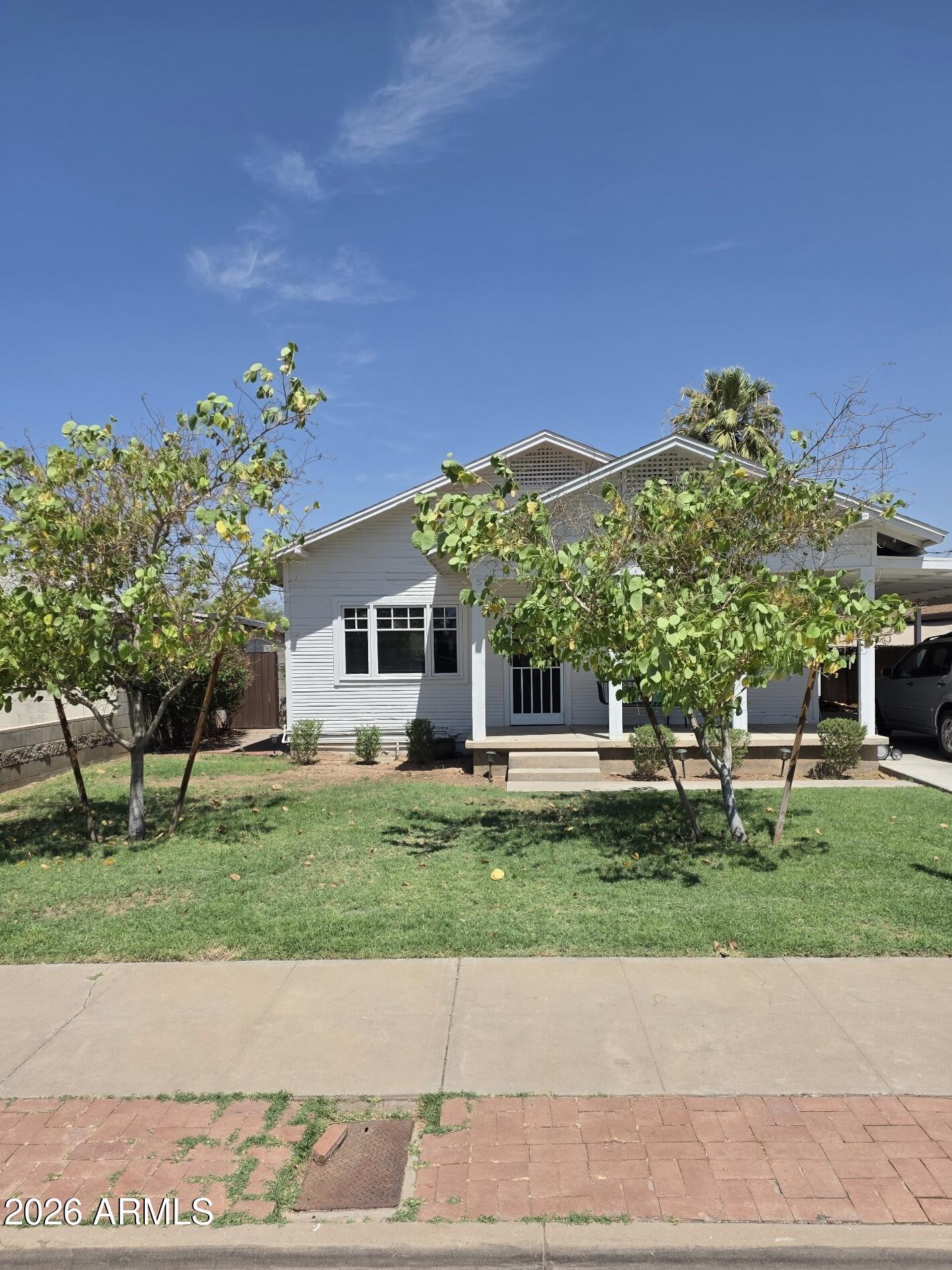 Welcome to the Historic Coronado District! Step into timeless elegance with this beautifully refreshed 1930s historic charmer, where classic character meets modern convenience. The main home offers approximately 1,150 sq. ft. of thoughtfully updated living space and has been meticulously maintained with numerous upgrades, including vintage-style wood plank flooring throughout, updated baseboards, dual-pane windows, utility gas installation for a gas range, dryer, and tankless water heater, water softener, and many tasteful aesthetic enhancements.The detached 440 sq. ft Casita  features 1bed/bath, kitchenette, living area, private patio, and neutral designer finishes. Completely landscaped, Car charging station, covered parking, and no HOA! Prime Downtown location and close to ASU.