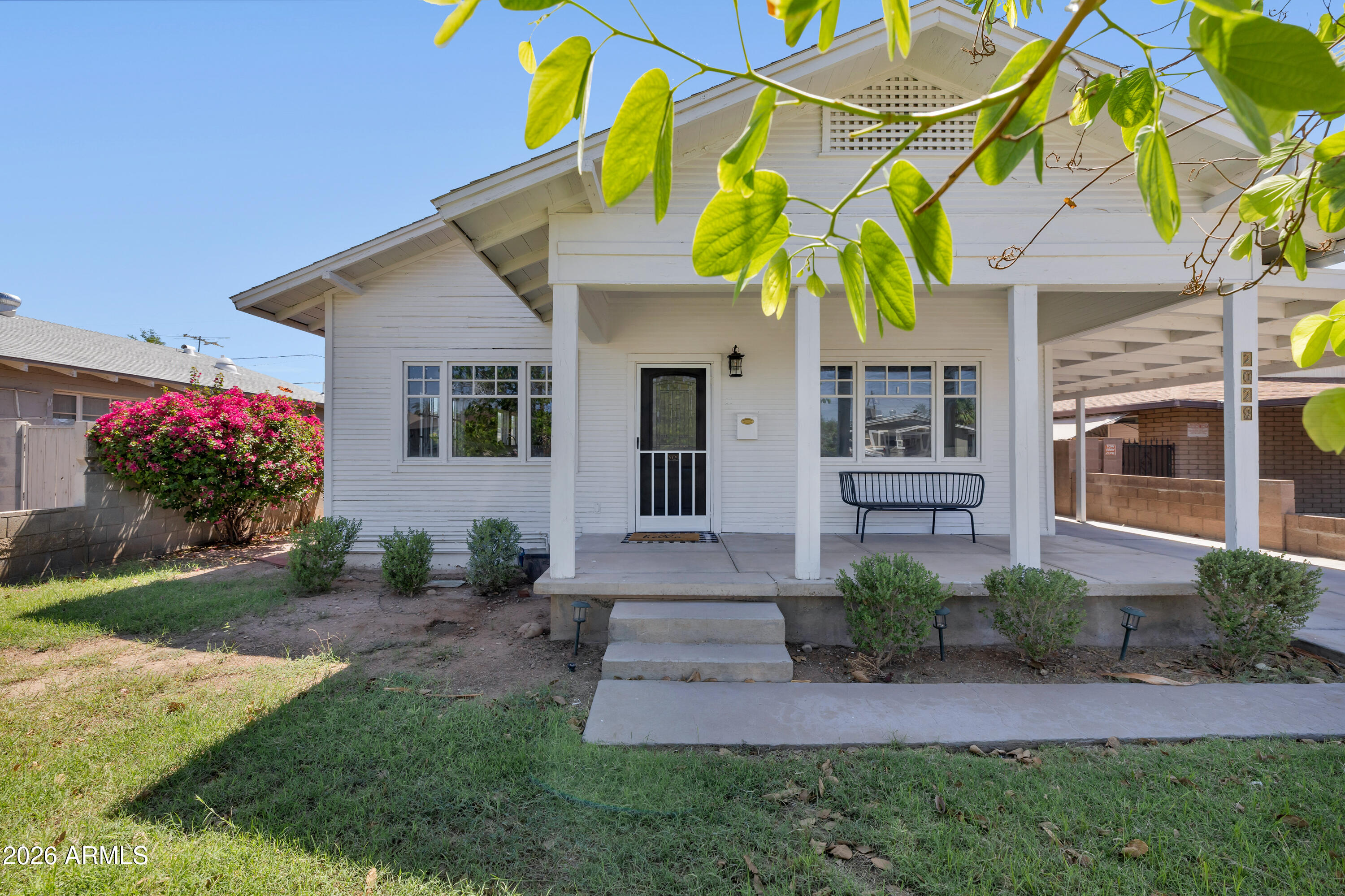 Welcome to the Historic Coronado District! Step into timeless elegance with this beautifully refreshed 1930s historic charmer, where classic character meets modern convenience. The main home offers approximately 1,150 sq. ft. of thoughtfully updated living space and has been meticulously maintained with numerous upgrades, including vintage-style wood plank flooring throughout, updated baseboards, dual-pane windows, utility gas installation for a gas range, dryer, and tankless water heater, water softener, and many tasteful aesthetic enhancements.The detached 440 sq. ft Casita  features 1bed/bath, kitchenette, living area, private patio, and neutral designer finishes. Completely landscaped, Car charging station, covered parking, and no HOA! Prime Downtown location and close to ASU.
