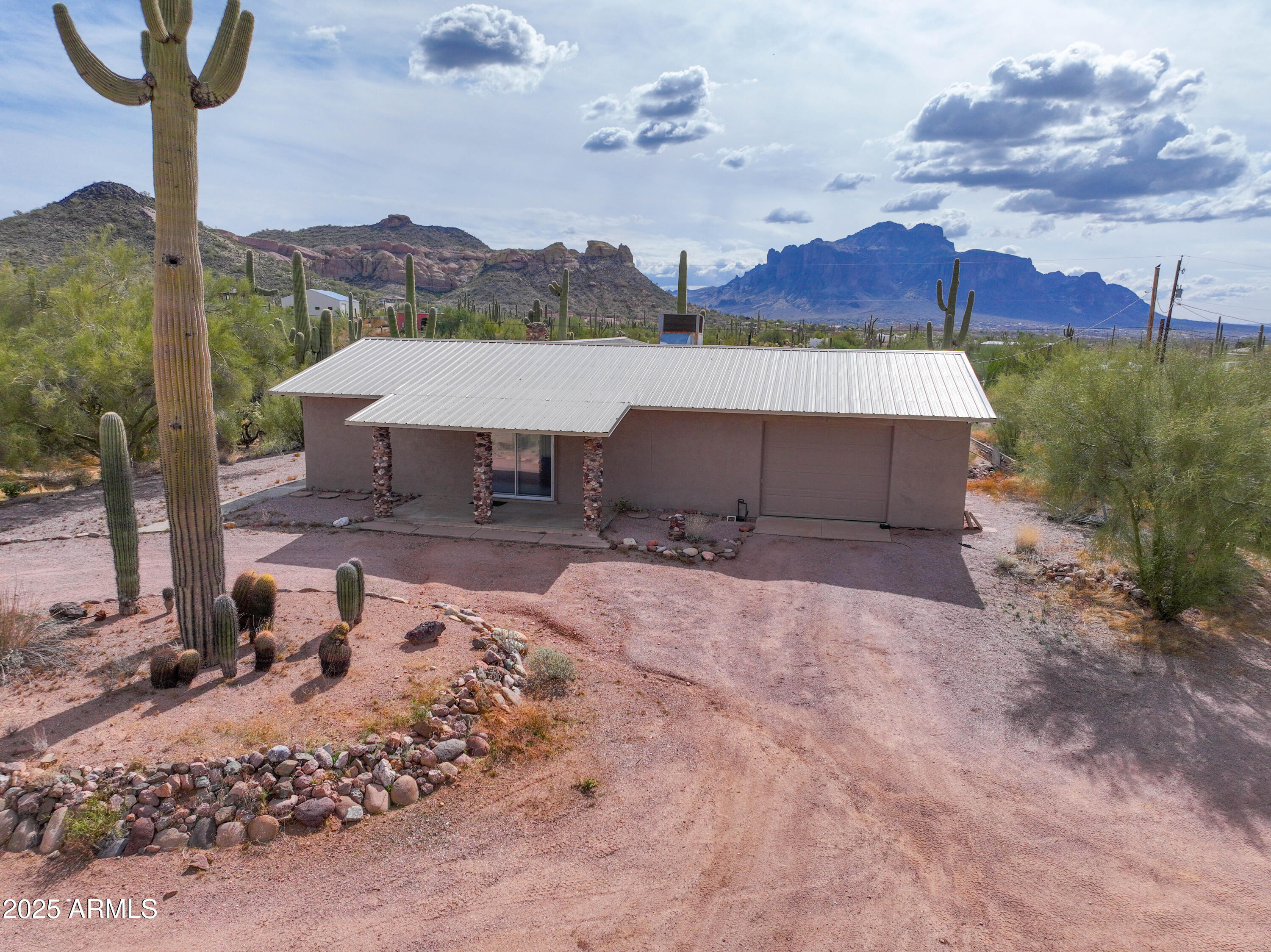 Gorgeous 5 acre lot with stunning views of the Superstition and Goldfield Mountains. Opportunity for Buyers who want space for all their toys or for Investors to develop the land. Main lot has a custom 2bed, 2 bath home, large barn and pen, water well and a tank for hauled water.