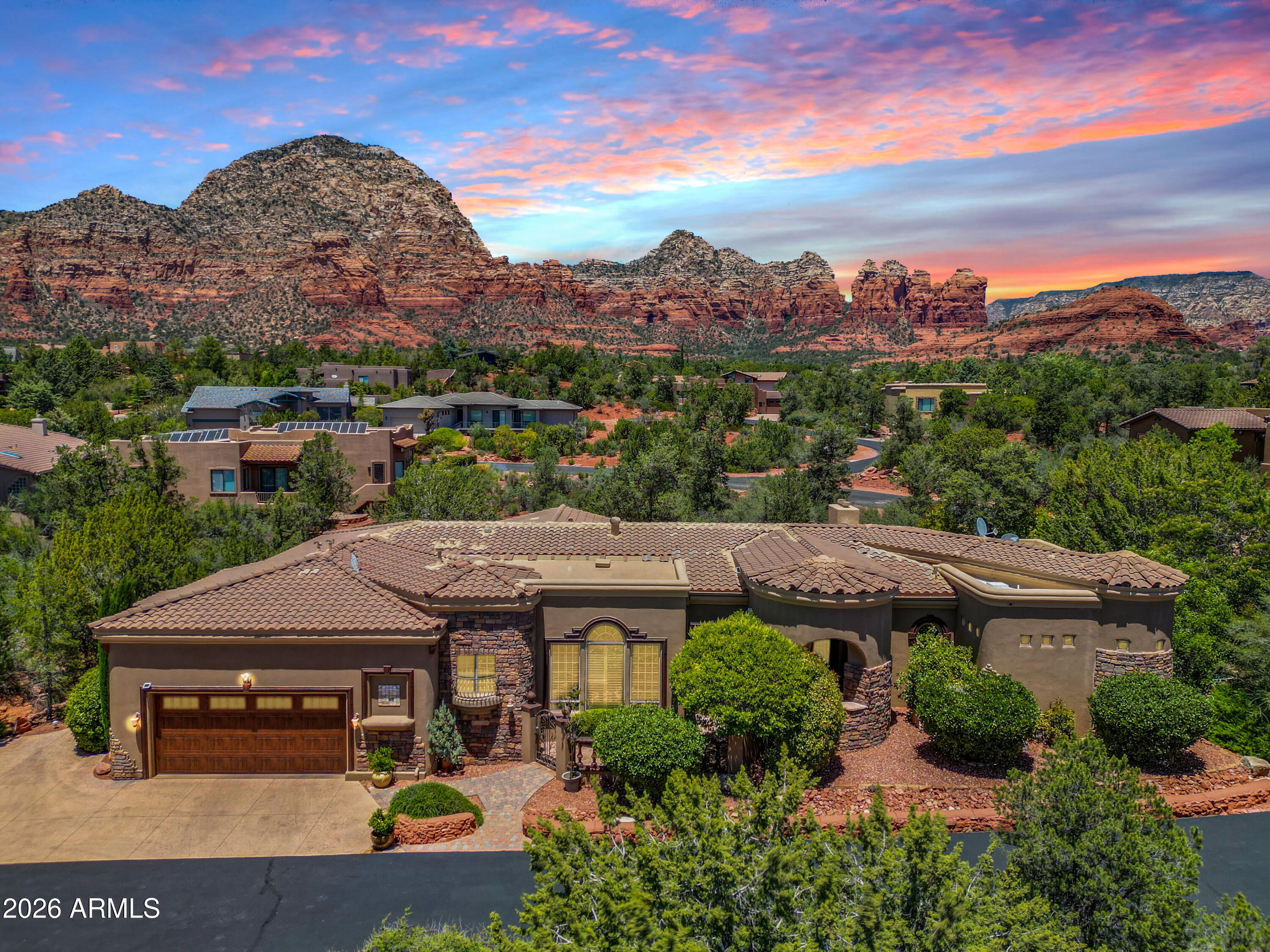 Welcome to Villa PietraSanta - Tucked away on a quiet no-outlet road in the heart of Sedona,  the rare blend of privacy, convenience, and true move-in-ready comfort. This beautifully maintained home sits in a prime central location with easy access to hiking trails, shops, restaurants, and everything Sedona has to offer, while still feeling like a private red rock retreat.

Designed with space and flexibility in mind, the home features a massive primary suite with outdoor access, a spacious bath, and excellent separation from the guest areas. Each bedroom includes its own private en-suite bathroom, creating comfort and privacy for family, guests, or potential rental use. Multiple living and dining areas provide plenty of room to entertain, gather, or relax, while the well-appointed kitchen, formal dining space, wet bar, fireplaces, and office nook add both function and character. Travertine Tile, detailed columns, and wooden beam accents give this home even more character.

Step outside and enjoy the cozy outdoor living space, complete with an outdoor fireplace and a Jacuzzi perfectly positioned to soak in Sedona's iconic red rock views. With generous indoor-outdoor living, excellent upkeep, and a secluded yet central setting, this is the kind of Sedona property that works equally well as a full-time residence, luxury getaway, or lock-and-leave retreat.

Private, polished, and ready to enjoy--this is an exceptional opportunity in one of Sedona's most desirable central locations.