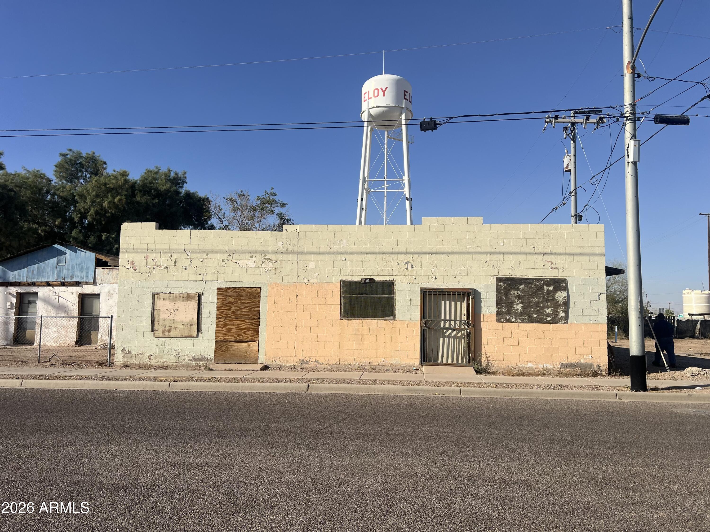 Exceptional investment opportunity with high-visibility frontage! Formerly a restaurant (per seller), this property is now zoned industrial, opening the door to various development possibilities. The current structure is non-operational and likely a teardown, providing a blank slate for your next project. Buyer to complete all due diligence with the City of Eloy Planning & Zoning. Perfect for investors or business owners looking to capitalize on an industrial-zoned parcel in a prime location.