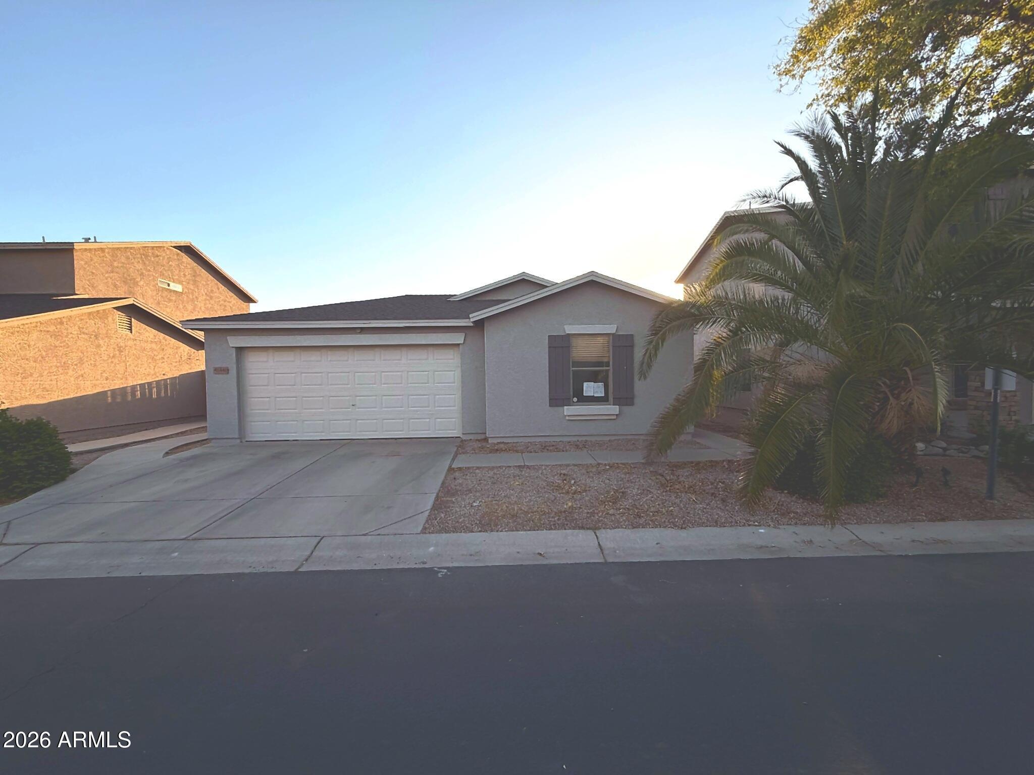 Clean single level San Tan Valley home with a functional open layout, neutral interior finishes, ceiling fans, tile in kitchen/dining areas, and a spacious main living room. Kitchen offers ample cabinetry, black appliances, pantry space, and access to the backyard. Private low-maintenance yard features artificial turf, desert landscaping, mature shrubs, block fencing, and an extended covered patio/pergola area for usable outdoor living. Two car garage, desert front landscaping, and established neighborhood setting. Great option for an owner occupant or rental investor.