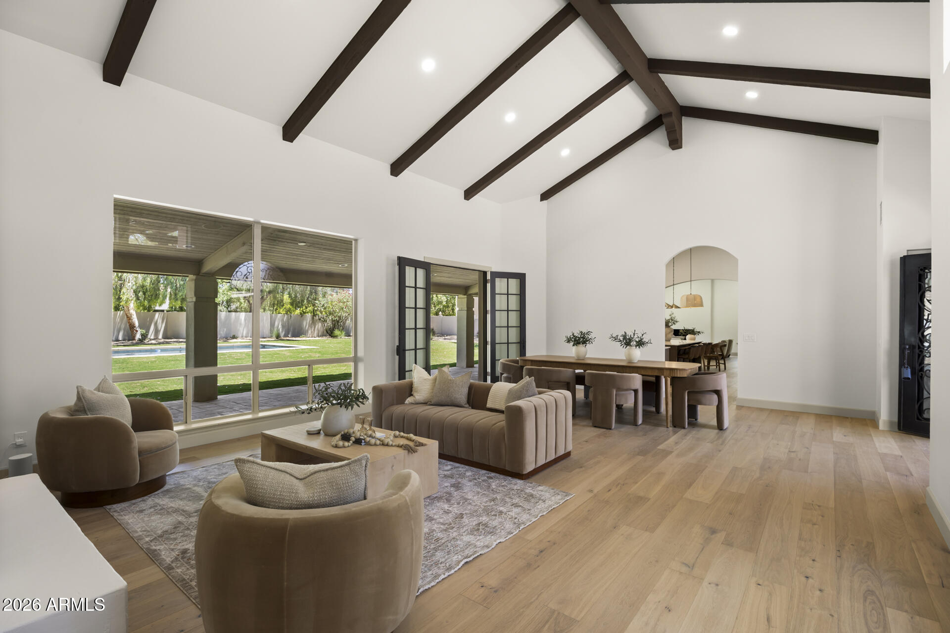 A complete reimagining in the heart of Scottsdale's coveted Cactus Corridor, this 5 bedroom, 3 full bath, 2 half bath residence blends timeless architecture with warm organic design. Thoughtfully reworked to appeal to a wide range of buyers, the floor plan offers seamless flow, generous living spaces, and an effortless indoor-outdoor lifestyle.

Curated finishes include custom cabinetry, natural stone surfaces, wood flooring throughout, and a premium Thermador appliance package. Nearly every major component of the home has been upgraded, including new AC units, tankless water heaters, and extensive interior and exterior improvements, creating a true turnkey experience. Set on an exceptional Cactus Corridor lot, the backyard was designed for both everyday living and entertaining, featuring a newly constructed pool, expansive outdoor spaces, and mature desert surroundings that create a private resort-like setting. A rare opportunity to own a fully renovated home in one of Scottsdale's most desirable locations.