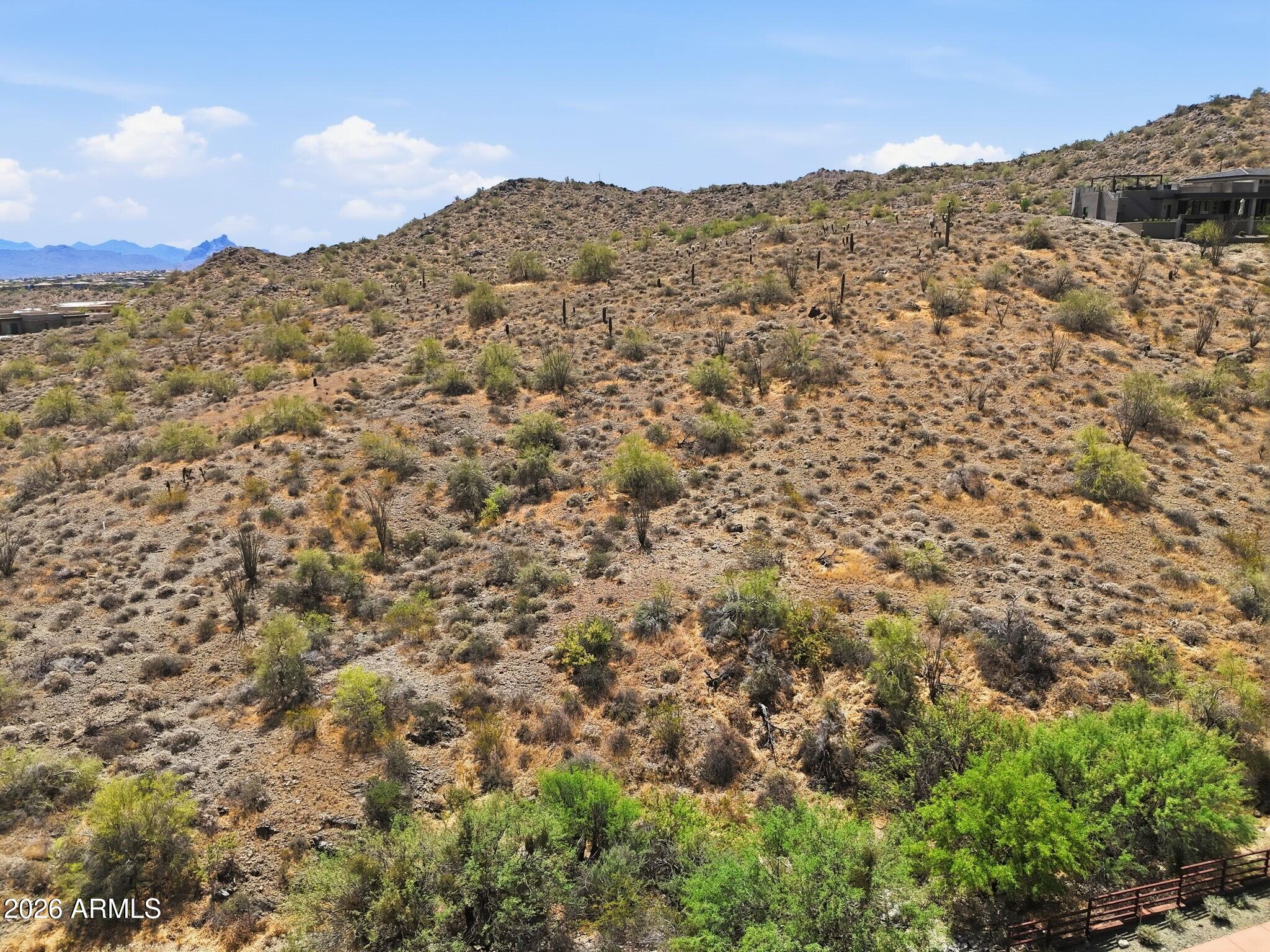 A phenomenal opportunity to create a truly bespoke hillside desert retreat within the prestigious, guard-gated Eagles Nest community. This expansive homesite captures breathtaking panoramic views of the surrounding Sonoran Desert, the iconic Four Peaks, and the renowned Fountain Hills Fountain. Set within this exclusive enclave of custom estates, Eagles Nest offers a rare blend of serenity and refinement, yet just minutes from world-class golf, scenic hiking trails, upscale shopping and dining, and the vibrant art and cultural experiences that define Fountain Hills living.
This is a rare opportunity to design and build a one-of-a-kind residence in one of Fountain Hills most sought-after luxury communities.