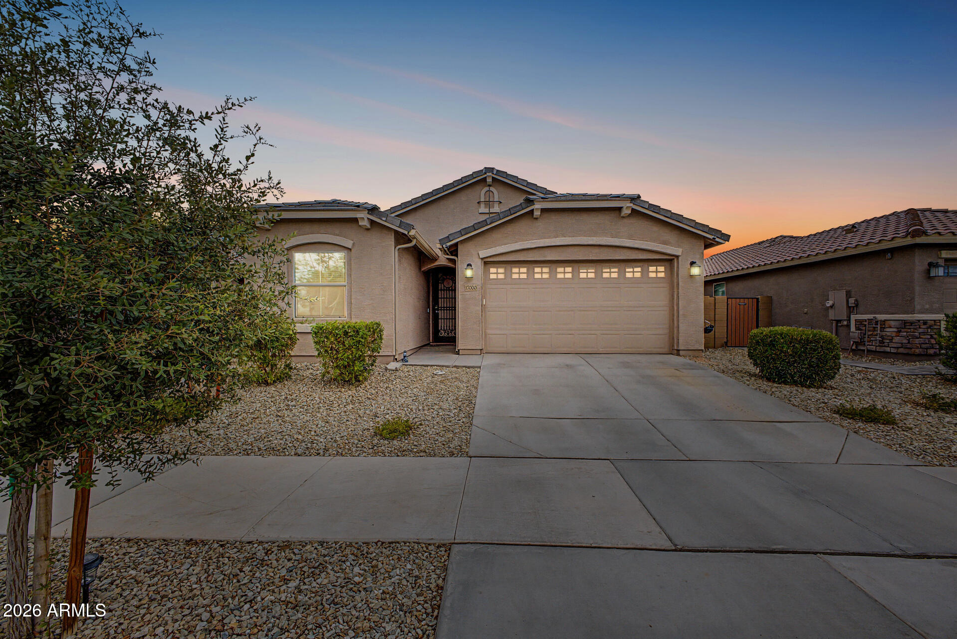 Skip the wait for new construction! This better-than-new 2023 home in the sought-after Asante community offers 5 bedrooms, 3 baths, and upgrades already completed. The open floor plan features soaring ceilings, tile flooring, granite countertops, 42'' white shaker cabinets, stainless steel appliances, a stylish tile backsplash, and an oversized island. Enjoy your resort-style backyard with a custom 2024 pool, gray travertine, Baja shelf with bubbler, LED lights, and a covered patio. Smart home technology controls the A/C., pool, and more from your phone, plus a home security system. Additional upgrades include an insulated garage door, epoxy-coated garage and patio, and keyless entry. Move in and enjoy!