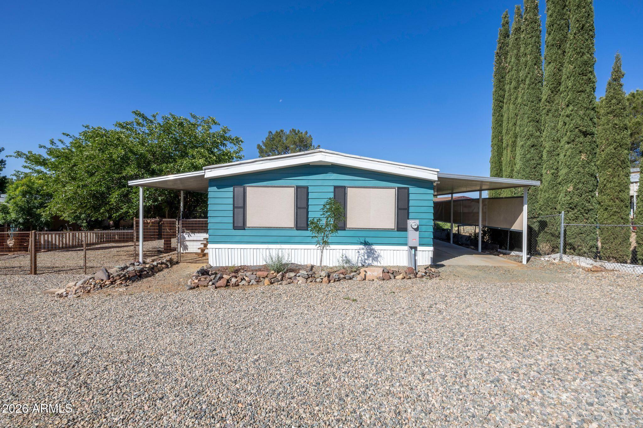 Step into this beautifully renovated 1980s doublewide situated on .206 acres and full of charm from the moment you arrive. With its adorable curb appeal and inviting presence, this home easily stands out as the most charming house on the street. Featuring 2 bedrooms and 2 bathrooms, this move-in-ready home blends modern updates with warm character and comfortable living. The thoughtfully updated interior offers refreshed finishes, bright living spaces, and a welcoming feel throughout. Whether you're looking for a full-time residence, investment property, or peaceful retreat, this property delivers style, comfort, and value with room to enjoy both inside and out.