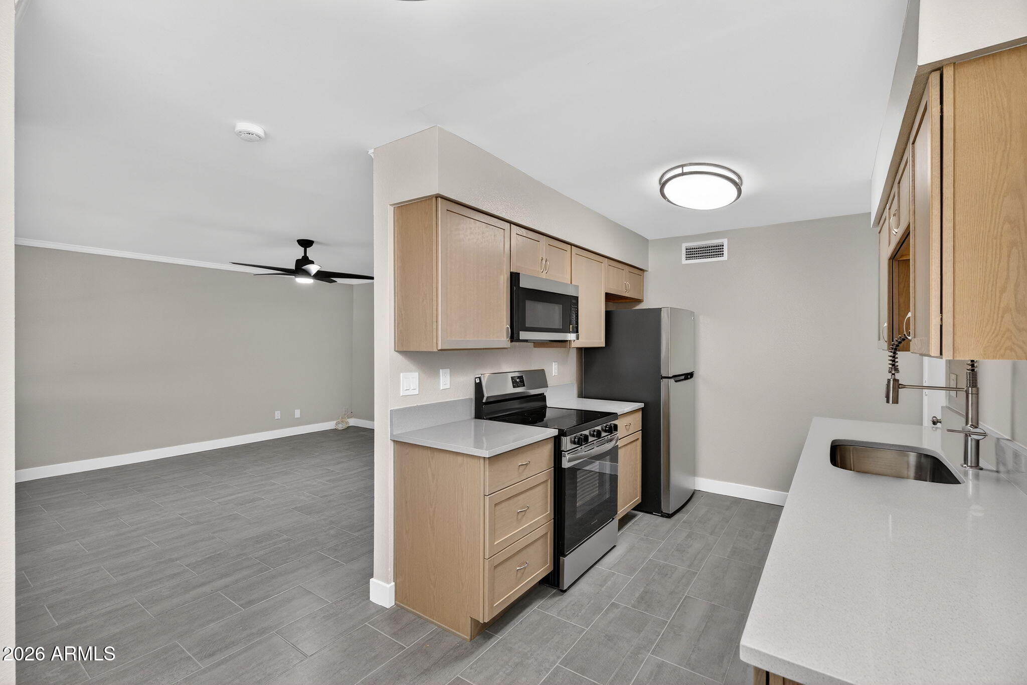 Beautifully remodeled 2 bedroom, 1.5 bathroom home with an added den/flex space in the desirable 55+ community of Sun Air Estates. A thoughtfully added partition creates a cozy and versatile bonus area perfect for a home office, reading nook, or hobby space.

The interior has been completely refreshed with modern finishes, creating a bright, inviting feel from the moment you walk in. The kitchen features stainless steel appliances, updated countertops, and a clean, contemporary design that flows seamlessly into the living areas. The spacious primary suite offers a large walk-in closet and private half bath, providing comfort and convenience.

Enjoy easy, low-maintenance living with HOA-covered yard care, exterior maintenance, and paint.
