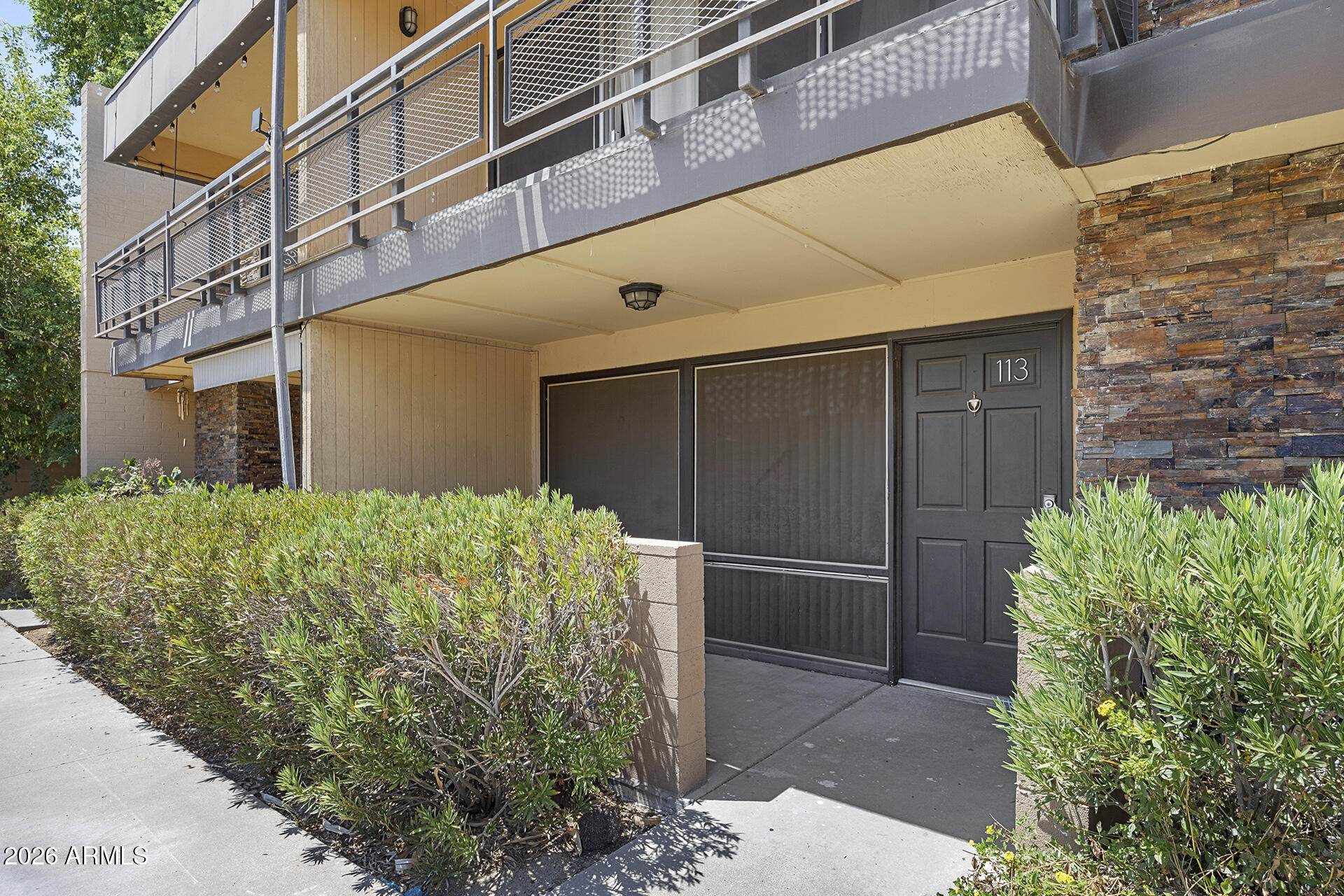 Turnkey and move-in ready in a charming Central Corridor gated community! This beautifully updated 2BD/1.5BA townhome features brand new carpet and fresh paint, granite countertops in the kitchen and baths, tile and wood flooring, and abundant storage throughout. Both spacious upstairs bedrooms offer walk-in closets, and the primary bedroom opens to a patio with views of the lush courtyard and mature palms. Enjoy two patios and access to the central community pool with stunning travertine decking, all within a beautifully landscaped gated community. All appliances included! Perfect as a primary residence, seasonal retreat, or investment. Welcome HOME!