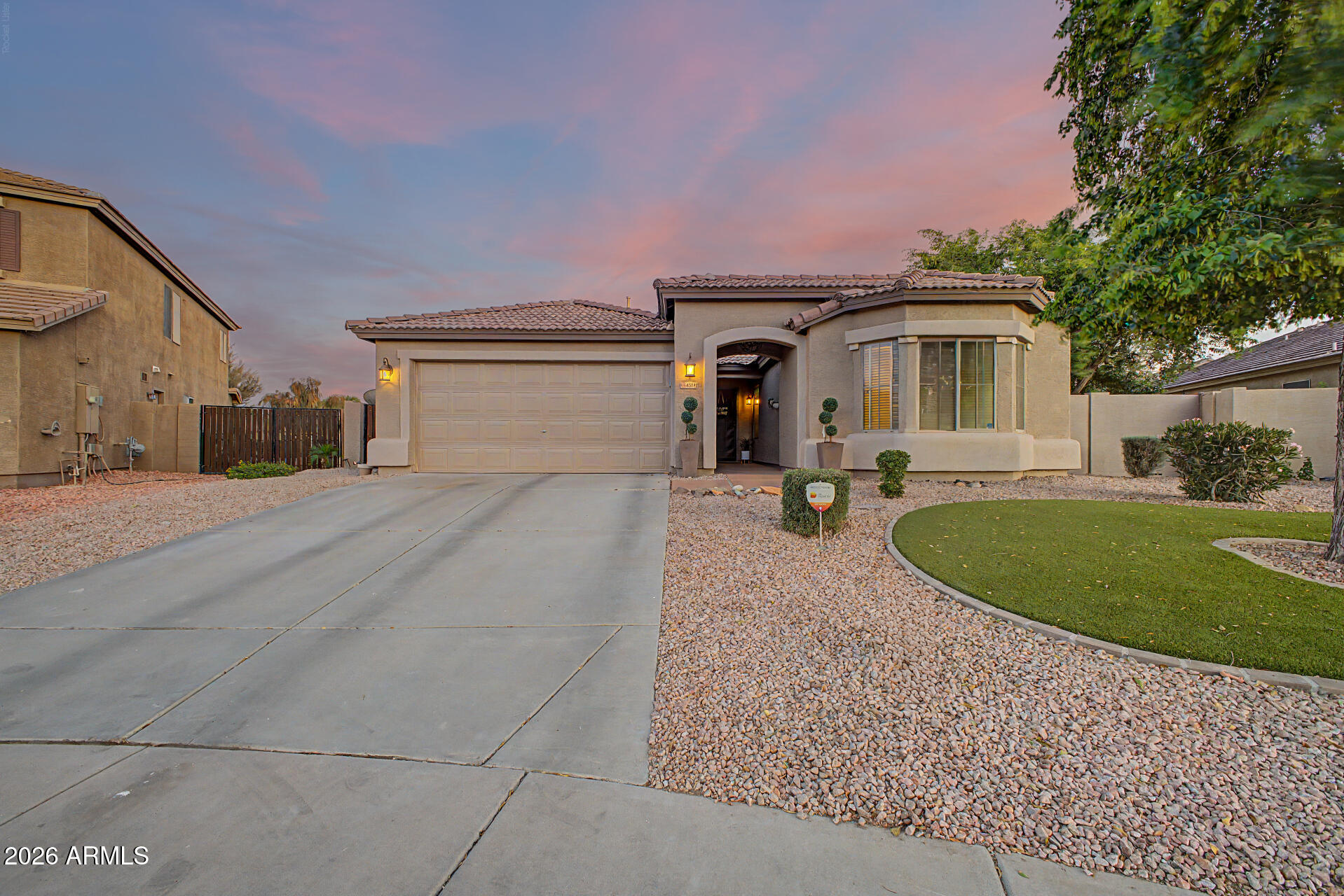 Located on a premium oversized north/south lot in the highly desirable Rancho El Dorado community in Maricopa, this move-in ready home offers a spacious split great-room floor plan with 4 bedrooms plus a den, vaulted ceilings, fresh interior paint, and luxury vinyl plank flooring throughout. Designed for both comfortable everyday living and entertaining, the home also features 2-inch blinds and surround-sound pre-wire. The open kitchen includes a large island/breakfast bar, raised-panel cabinetry with hardware, pantry, reverse osmosis system, and stainless-steel appliances. The spacious owner's suite features vaulted ceilings, a bay window, and private patio access. The remodeled owner's bathroom showcases a new vanity with quartz countertops, dual sinks, updated mirrors, fixtures, and faucets, plus a walk-in glass shower with tile surround and separate soaking tub. Step outside to a true backyard retreat featuring a full-length covered patio with wood-beam ceiling, ceiling fan, and speaker pre-wire, along with a second covered patio off the owner's suite. The resort-style backyard includes a PebbleTec pool with baja step and waterfall, built-in BBQ, large grass area, mature landscaping, paver sitting area, and a Tuff Shed for additional storage. The 2-car garage includes cabinets, workbench, and service door, while the RV gate provides easy backyard access. Rancho El Dorado is one of Maricopa's premier master-planned communities, known for its mature landscaping, parks, walking paths, lakes with catch-and-release fishing, and family-friendly atmosphere. Residents enjoy peaceful desert living while remaining close to shopping, dining, entertainment, and commuter access. If you're searching for a home in Maricopa with a pool, RV gate, oversized lot, updated owner's bath, and resort-style backyard, this Rancho El Dorado property delivers space, lifestyle, and value in one of the area's most established neighborhoods.