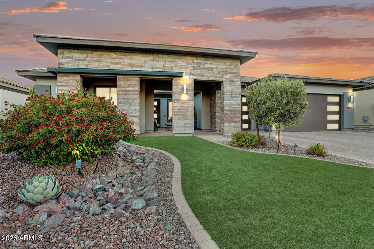 SPECTACULAR GOLF COURSE ORION MODEL AVAILABLE ON A PREMIUM LOT AT TRILOGY AT VERDE RIVER! This modern masterpiece boasts three spacious Bedrooms, an open Office, Media/Flex Room, 3 car garage, and 3.5 bathrooms. Home includes whole home Solar greatly reducing energy costs. All bedrooms have private ensuite bathrooms, so your guests will feel at home! The heart of this home is the gourmet chef's kitchen featuring granite countertops, a GE Monogram gourmet appliance package, custom cabinets package, and designer tile backsplash. The pendant lights and dining room light are elegant and add the perfect touch of sophistication. The great room showcases a sliding wall of glass that seamlessly connects the indoor and outdoor spaces. Step outside to the large backyard, where you are greeted by a spectacular view of the mountains and the pristine golf course. This is the perfect place to entertain guests, relax, and enjoy the natural beauty that surrounds you. The primary suite is a true retreat, designed to enhance your sense of tranquility with natural light that pours in through large windows, and a spa-like ensuite bathroom featuring a deep soaking tub, a tiled shower, and a dual sink vanity with custom mirrors and quartz countertops. With its stunning location on a premium golf course lot and mountain views, it offers a lifestyle that is truly unparalleled. 
Don't miss this opportunity to own a truly remarkable property in the prestigious Trilogy at Verde River.
 Trilogy at Verde River offers upscale Resort living at its finest and the very best of all possible worlds, close to the conveniences of affluent North Scottsdale, yet secreted within the pristine privacy of the Sonoran Desert.
The amenities are World Class with Tom Lehman inspired eighteen-hole Golf course, tennis courts, pickle ball courts, and bocce ball, heated lap pool and Resort style swimming pool, hot tub, Afterburn fitness center, Helen's demonstration Kitchen for cooking classes and a 7.5 acre dog park. The community center has casual poolside dining at Eddy's Diner and gourmet dining at award-winning Needle Rock Kitchen and Tap, Alvea Spa with full-service Salon and Spa amenities, Art Loft and events center. Trilogy at Verde River is adjacent to the Tonto National Forest and is situated in the middle of miles and miles of hiking and biking trails.
Whether you're seeking a second, winter home, or will live here year-round, Trilogy at Verde River is an ideal distance from the hustle and bustle of North Scottsdale. You'll love the Resort living!
What memories will you make?