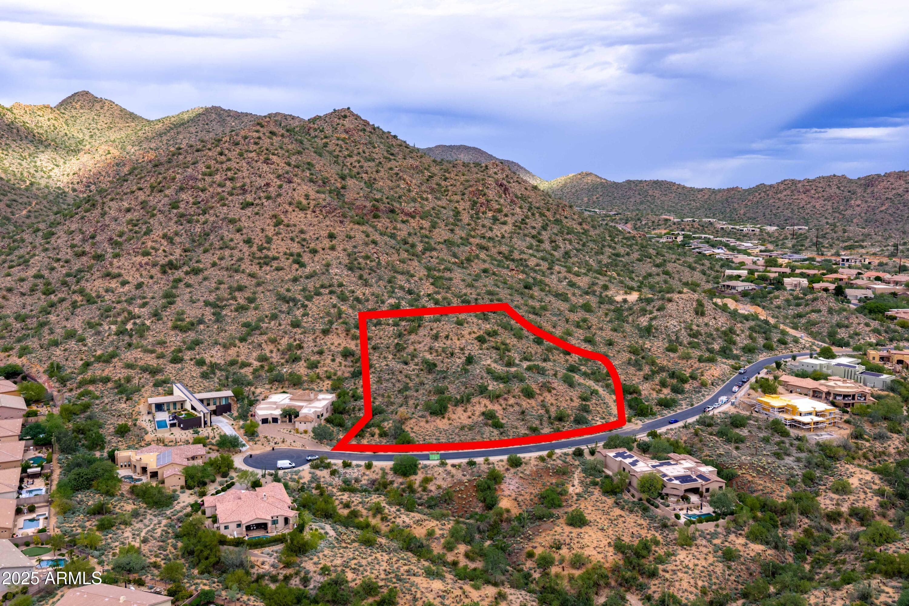 Rare opportunity to own 2.28 acres of pristine mountainside land in the gated community of Hidden Hills! This custom home lot offers exceptional privacy, peace and natural beauty while backing directly to the McDowell Mountain Preserve. Enjoy sweeping desert and mountain views with direct access to hiking and biking trails,  including the popular Sunrise Trailhead. Located behind double gates, this premium homesite provides the ideal setting to build your custom dream home. Conveniently close to the Mayo Clinic, Shea Corridor, and world-class Scottsdale amenities, experience the perfect balance of serenity and accessibility in one of Scottsdale's most desirable locations.