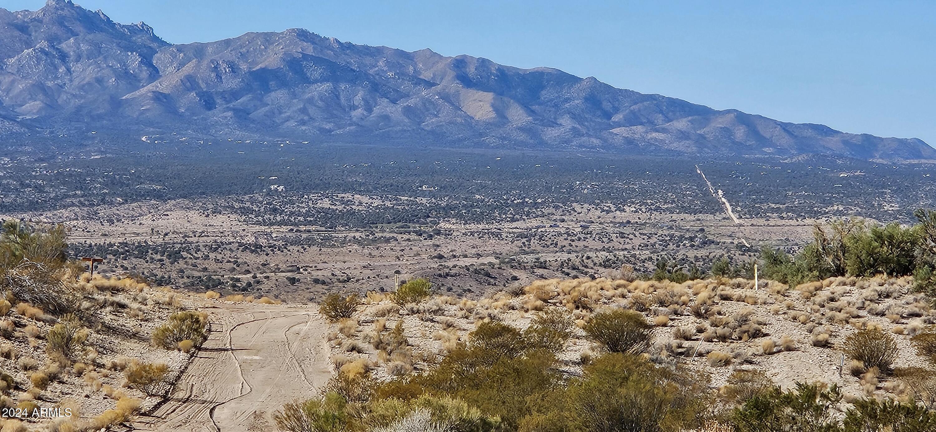 Looking for a great hideaway property?    What a perfect parcel with hill top views and a picturesque valley with many mature juniper trees. This 17.8 acre parcel has several potential building areas and plenty of room to roam.  No HOA and No CCR's.  This is ready for you to make it just the way you want. Off grid but great cell service. Away from it all you find this to be a parcel for adventure.  Zoned AR 8.