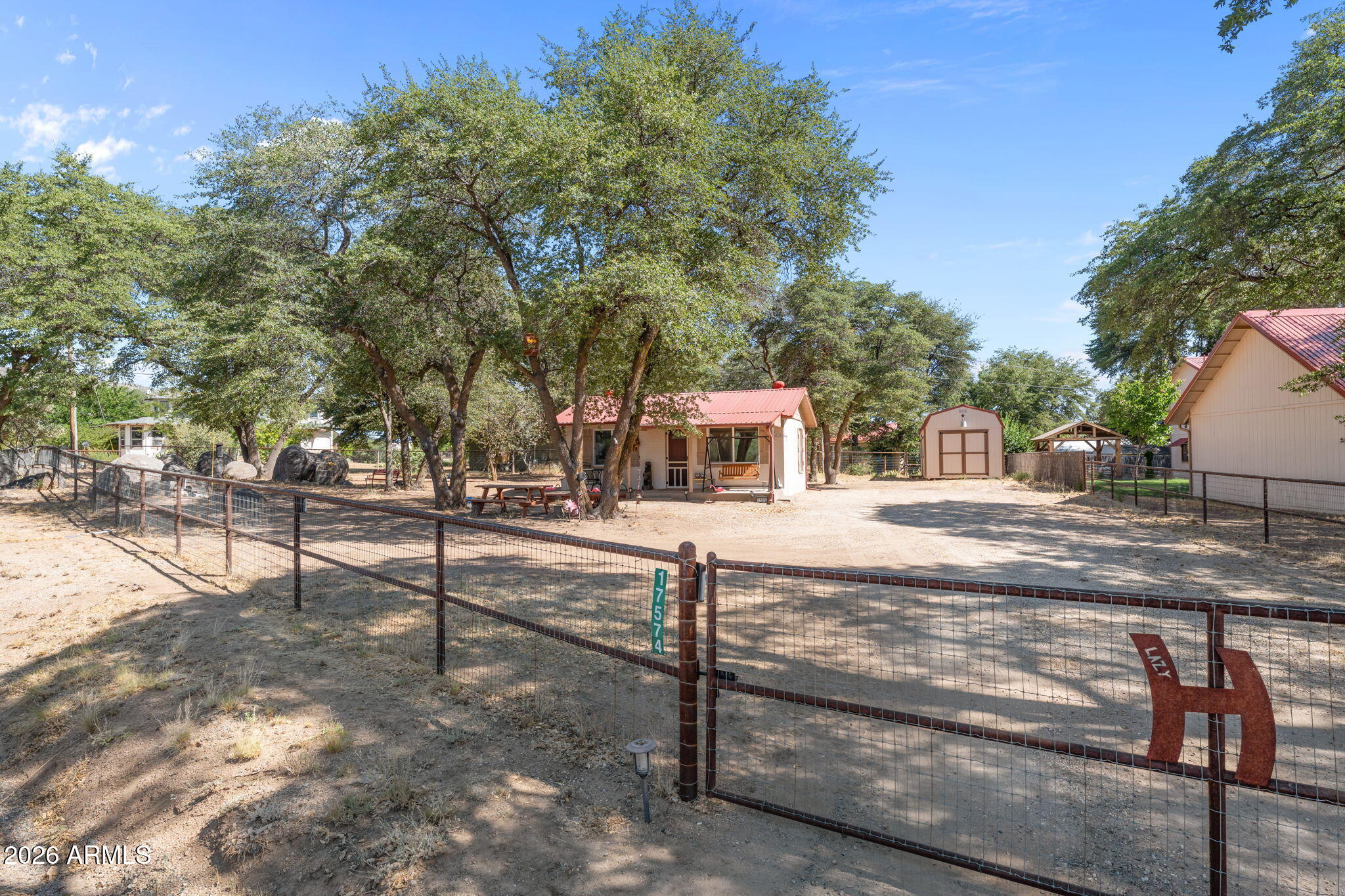 The best part about getting away is knowing you don't have to go very far. An easy drive from the Valley, this inviting 1-bedroom, 1-bath home feels a world away from Phoenix without spending half your weekend getting there. Pull through the gated entrance and leave the traffic, city life and to-do lists behind. The fully fenced yard offers plenty of room for kids and pets to play, while mature shade trees set the scene for afternoon barbecues, evenings around the grill and mornings that begin a little slower. Two storage sheds provide space for tools, outdoor gear and weekend toys, and the new septic system adds peace of mind for years to come. Whether you're looking for a weekend retreat or a place to call home year-round, this is the kind of property that reminds you why people head for the mountains in the first place.