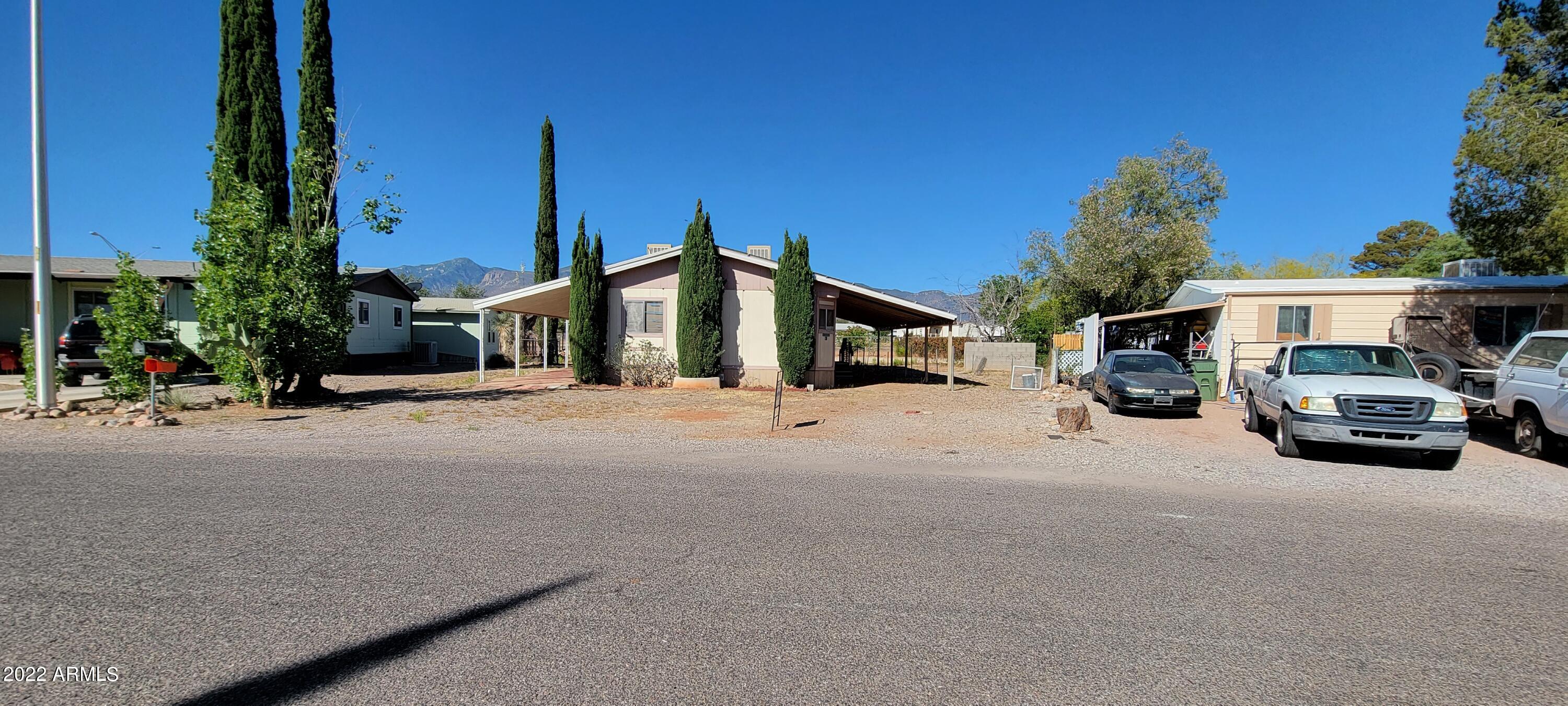 Looking for that hard to find flip? Look no further. This home has a great floor plan and just needs some TLC. There is a large living room and there is room enough for dining in there too. There is also an area for a table in the kitchen. There is a ton of counter space in the kitchen. The master bedroom os good sized and has a walk in shower. The main bath has a bath tub. The secondary bedroom is also very large. There are 2 carports, one on each size with covered patio space as well. The backyard has chain link fencing and hace a nice mountain view. At only 79900, this will not last!
