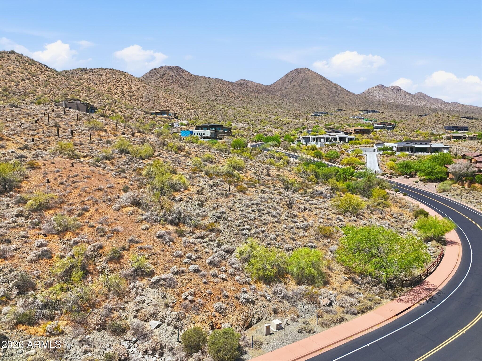 A phenomenal opportunity to create a truly bespoke hillside desert retreat on a premium corner lot offering enhanced privacy, expanded frontage, and elevated positioning within the prestigious, guard-gated Eagles Nest community. This expansive homesite captures breathtaking panoramic views of the surrounding Sonoran Desert, the iconic Four Peaks, and the renowned Fountain Hills Fountain. Set within this exclusive enclave of custom estates, Eagles Nest offers a rare blend of serenity and refinement, yet just minutes from world-class golf, scenic hiking trails, upscale shopping and dining, and the vibrant art and cultural experiences that define Fountain Hills living. This is a rare opportunity to design and build a one-of-a-kind residence in one of Fountain Hills most sought-after luxury communities.