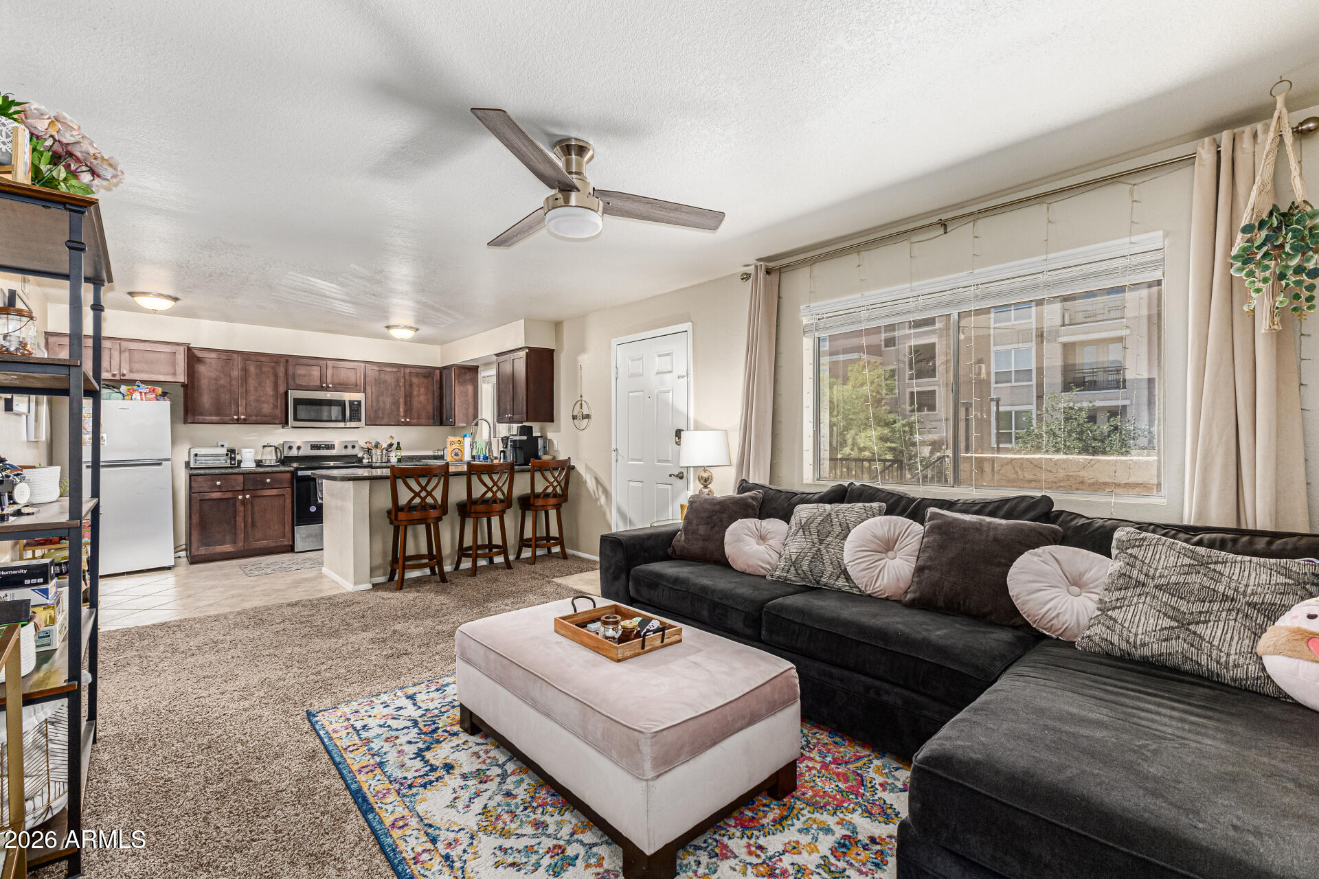 SELLING FURNISHED! Welcome to this charming and ideally located condominium in the heart of Tempe! Perfectly situated near Arizona State University, this inviting second-floor unit offers a blend of comfort, convenience, and low-maintenance living. The thoughtfully designed floor plan features a bright and open living space filled with natural light, creating a warm and welcoming atmosphere. The well-appointed kitchen offers ample cabinetry and counter space, seamlessly connecting to the dining and living areas ideal for both everyday living and entertaining.

The spacious bedroom provides a relaxing retreat with generous closet space, while the full bathroom is designed for functionality and comfort. Additional highlights include assigned parking and access to community amenities such as a refreshing pool and well-maintained common areas.

Located just minutes from ASU, Mill Avenue, Tempe Town Lake, and Tempe Marketplace, this home offers unparalleled access to shopping, dining, entertainment, and outdoor recreation. With close proximity to the Light Rail, Loop 202, and Loop 101, commuting throughout the Valley is effortless. Ideal for students, professionals, first-time buyers, or investors, this condo presents an exceptional opportunity in one of Tempe's most desirable and vibrant locations. Don't miss your chance to own a piece of the Tempe lifestyle!