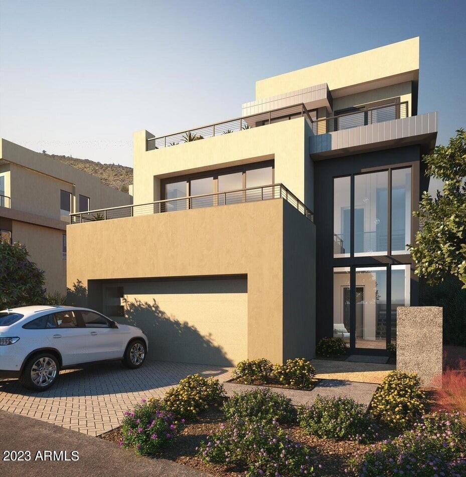 A NEW PRIVATE RESIDENTIAL COMMUNITY WITH A COVETED LOCATION AT THE BASE OF CAMELBACK MOUNTAIN ADJACENT TO THE ICONIC PHOENICIAN® IN SCOTTSDALE. ONLY A SHORT DISTANCE TO FASHION SQUARE AND OLD TOWN SCOTTSDALE. THIS CIRRUC C FLOOR PLAN, BUILT EXCLUSIVELY BY CULLUM HOMES, IS A 3-LEVEL HOME FEATURING 4 BEDROOMS, 4.5 BATHROOMS, A PRIVATE OFFICE AND A 2-CAR GARAGE. THROUGH THE EXTRAVAGANT FRONT ENTRANCE LOCATED ON THE LOWER LEVEL, A BEAUTIFUL STAIRCASE OR AN ELEVATOR TAKE YOU TO EVERY LEVEL OF THE RESIDENCE. THE MAIN LEVEL BOASTS TWO EN SUITE BEDROOMS, PRIVATE OFFICE, FORMAL DINING AREA, BUTLER'S PANTRY, OPEN CONCEPT KITCHEN, ADDITIONAL POWDER ROOM AND THE GREAT ROOM AREA. SPACIOUS KITCHEN WITH ISLAND, EAT-AT BAR AND WALK-IN PANTRY. A GLASS WALL LEADS YOU TO THE COVERED PATIO OFF THE GREAT ROOM WHERE GORGEOUS VIEWS AWAIT YOU. OWNER'S SUITE WITH WALK-IN CLOSET, DOUBLE SINK VANITY, SEPARATE TOILET ROOM, TUB AND WALK-IN SHOWER SIT ON THE TOP LEVEL. ALONG WITH A LARGE LAUNDRY ROOM WITH EXTRA STORAGE, PRIVATE OFFICE SPACE AND TWO DECKS. THE COMMUNITY IS GUARD GATED FOR PRIVACY AND SECURITY. AT THE BASE OF CAMELBACK MOUNTAIN, YOUR PRIVATE POOL, FITNESS CENTER, AND SOCIAL SPACES OFFER AN INTIMATE GATHERING PLACE FOR WELLNESS, SOCIALIZING AND RELAXATION. RESIDENTS ARE OFFERED THE OPTION TO JOIN THE PHOENICIAN® AMENITY ACCESS PROGRAM  ACCESS AND DISCOUNTS TO THE NEW ATHLETIC CLUB, 38,000 SQUARE FOOT SPA, TENNIS FACILITY AND RESORT POOLS AT THE PHOENICIAN® RESORT.