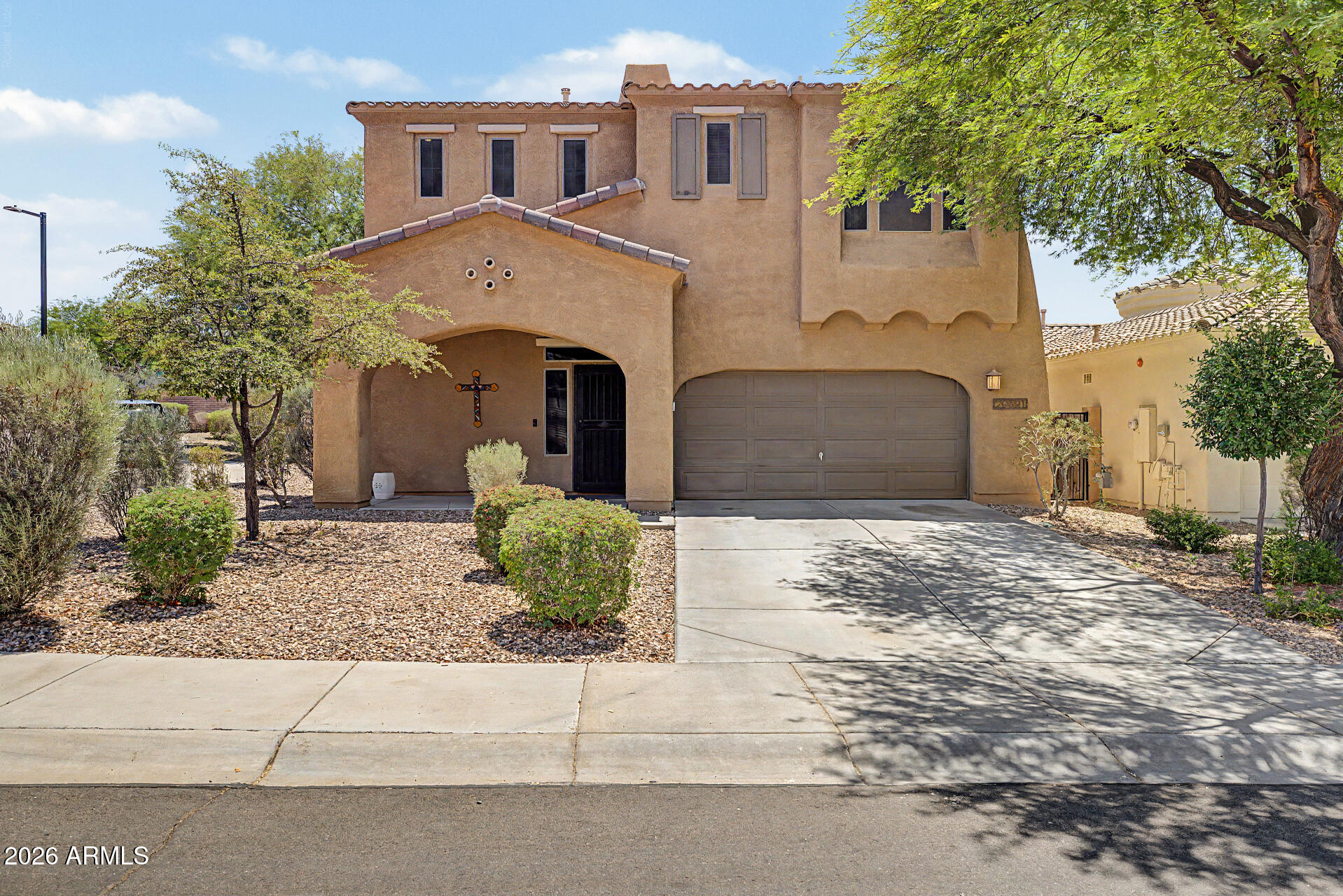 Welcome home to this beautifully cared-for Ashton Woods home in the heart of Vistancia! Designed for both everyday living and entertaining, this 2-story, 4-bedroom, 2.5-bath home features vinyl plank flooring installed in 2020, fresh interior paint, and a newer water heater. The spacious kitchen offers abundant cabinet space, an island, large dining area, and a built-in workspace. Upstairs you'll find a versatile loft with an additional built-in workspace, perfect for working from home, homework, or hobbies. Step outside to enjoy the large shaded backyard with mature citrus trees. Conveniently located near award-winning Vistancia Elementary, community pools, tennis courts, parks, trails, shopping, dining, and easy access to Loop 303.