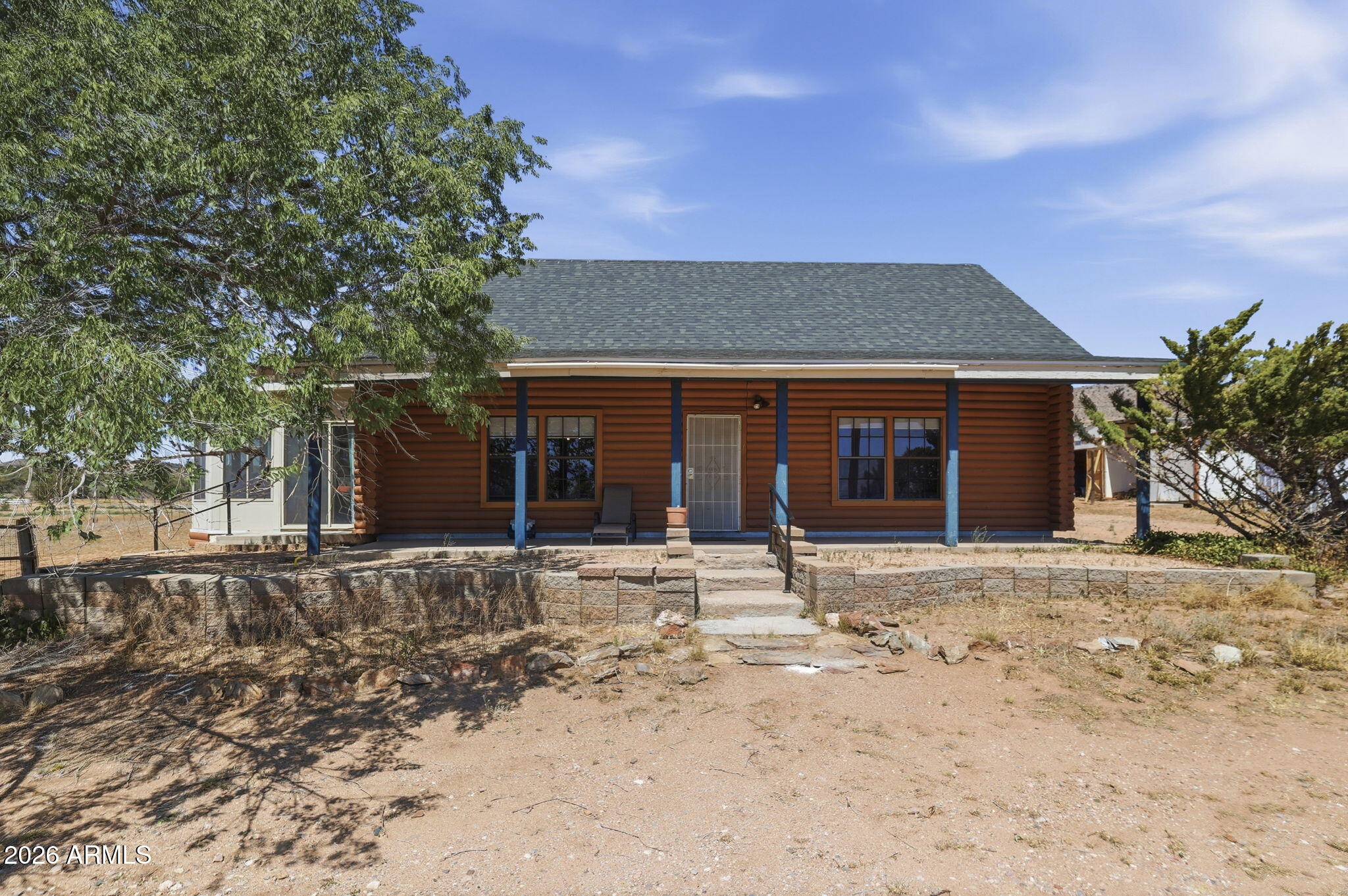 PRICED TO SELL!

Move in ready with most furnishings included! Tucked away in Northwest Chino Valley, this charming cabin sits on 2.34 acres, providing the quiet country lifestyle you've been dreaming of. The main level features two spacious bedrooms, two full bathrooms, a stunning floor to ceiling shale wood burning fireplace, and an oversized 14' x 28' Arizona room that's perfect for relaxing or entertaining. Upstairs, the expansive loft offers flexibility, with built in closets and enough space for two additional bedrooms, or one bedroom with a spacious living area, office, hobby room, or bonus space. Recent upgrades include:

*New 45-year architectural shingle roof (2026)
*Upgraded 1,000-gallon septic system (2025), including septic risers and new Schedule 40 ABS septic lines
*Like-new kitchen cabinets (circa 2023)
*New 40-gallon water heater (2025) with warranty
*Like-new refrigerator (circa 2024) with a 5-year extended warranty
*Like-new washer and dryer with a 5-year extended warranty
*2,500-gallon water storage tank (circa 2023) with a 10-year warranty
*Like-new MasterCool evaporative cooler (2024) with an extended warranty
Bring your horses and farm animals! The property is equipped with four yard hydrants, irrigation, plenty of parking, and room to grow. Lovingly maintained using organic, pesticide free weed and pest control, this property offers breathtaking views of the San Francisco Peaks, neighboring horse properties, and the peaceful beauty of Northern Arizona. Whether you're looking for a full time residence, weekend retreat, or hobby farm, this cozy cabin feels like your own private nature sanctuary. With endless potential, an exceptional price, and a motivated seller open to reasonable offers, this is one you won't want to miss!