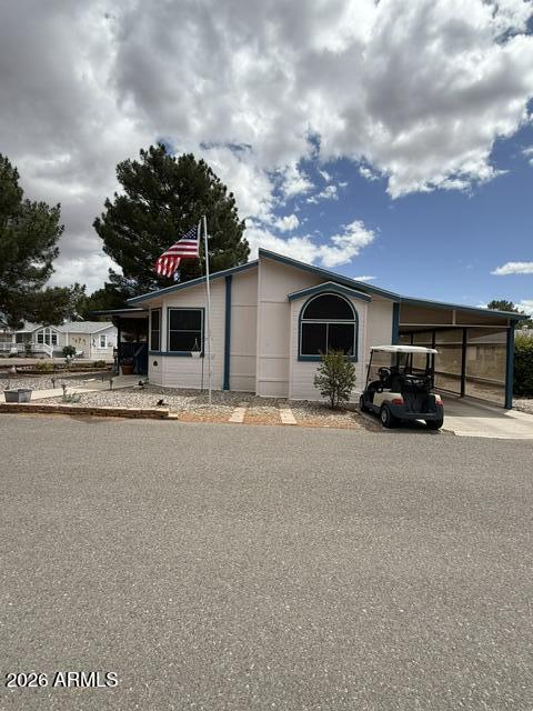 *INSPECTIONS COMPLETE*Move in ready! Welcome to easy, comfortable living in this beautifully maintained manufactured home located in a desirable senior community. Featuring a spacious open floor plan with exceptional natural lighting, ceiling fans in every room, nice size Den\craft room\office, carpeted screened Arizona room, screen room for your fury friend also, His and Hers golf cart parking, raised garden bed and storybook views, situated on a large corner lot and so much more! Primary suite has Smart TV already hung on the wall. The community itself is active and vibrant, offering a variety of amenities and social opportunities that make it easy to stay connected and engaged. Whether you're looking to relax or participate, this neighborhood has something for you. $2000 carpet credit!