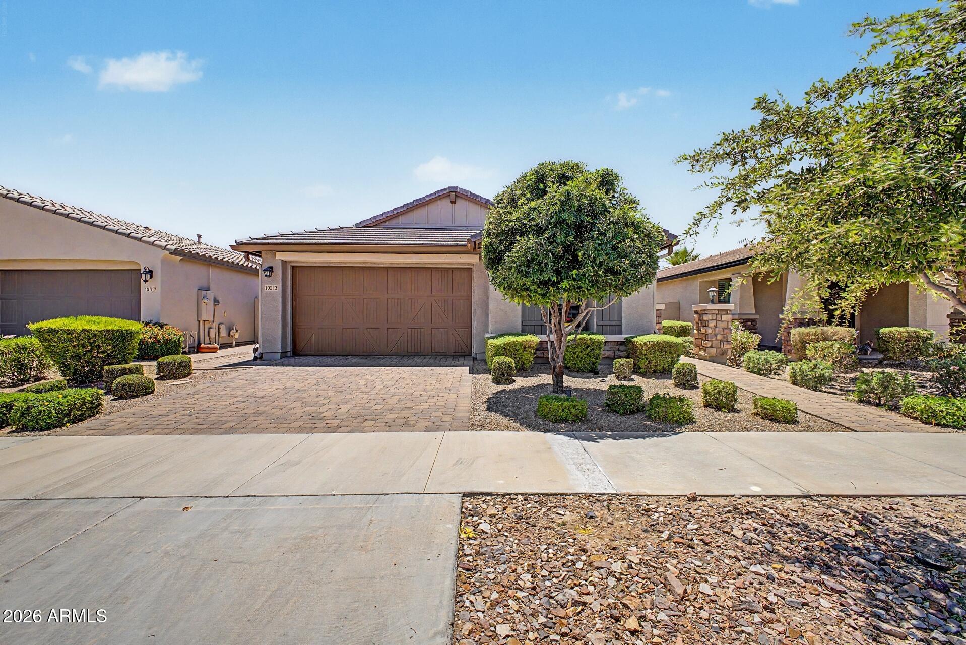 Beautiful single-level home in the highly desirable Encore at Eastmark active adult community, this popular Tango split floorpan features 2 bedrooms, 2 bathrooms, an open concept layout, granite countertops, kitchen Island, and a spacious primary suite with double vanities and walk-in closet. Added storage in the garage, pantry and closets. Enjoy Arizona living on the covered and screened patio overlooking low maintenance desert landscape. Residence enjoy resort-style amenities including clubhouse, pool, pickle ball courts, walking paths, and numerous community activities. Conveniently located near shopping, dining, medical facilities, golf, and major freeways, this home offers the perfect combination of comfort, convenience, and active adult living.