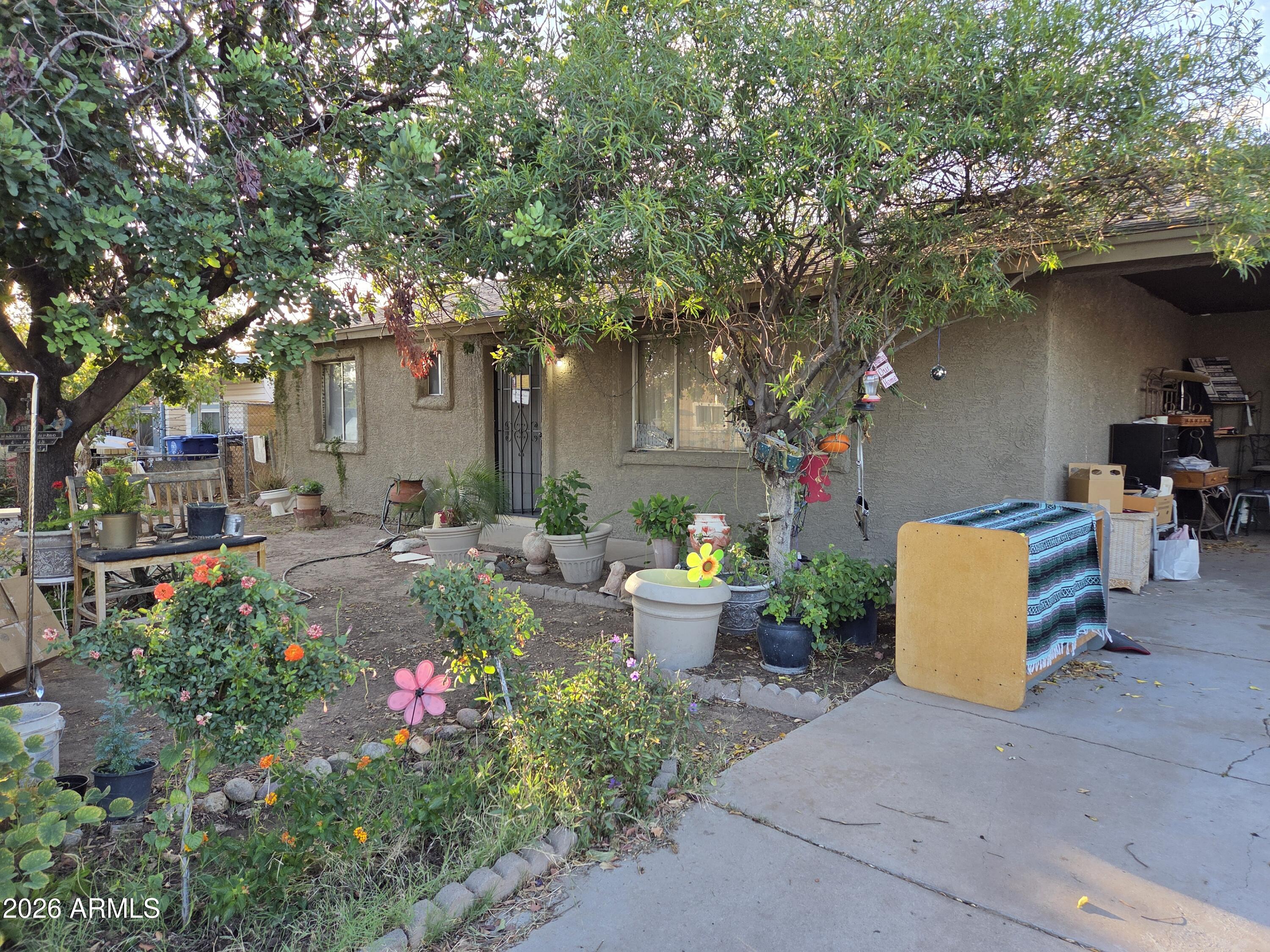 Great Potential with this gem!  Permitted addition of 588 sqft.  Wood burning fireplace, Large backyard with fruit trees, great room and additional workshop room and inside laundry.  Huge front yard and plenty of room to park your toys and vehicles in the carport and side entry to the backyard.  Close to shopping and Grand Ave for easy access to any part of town.