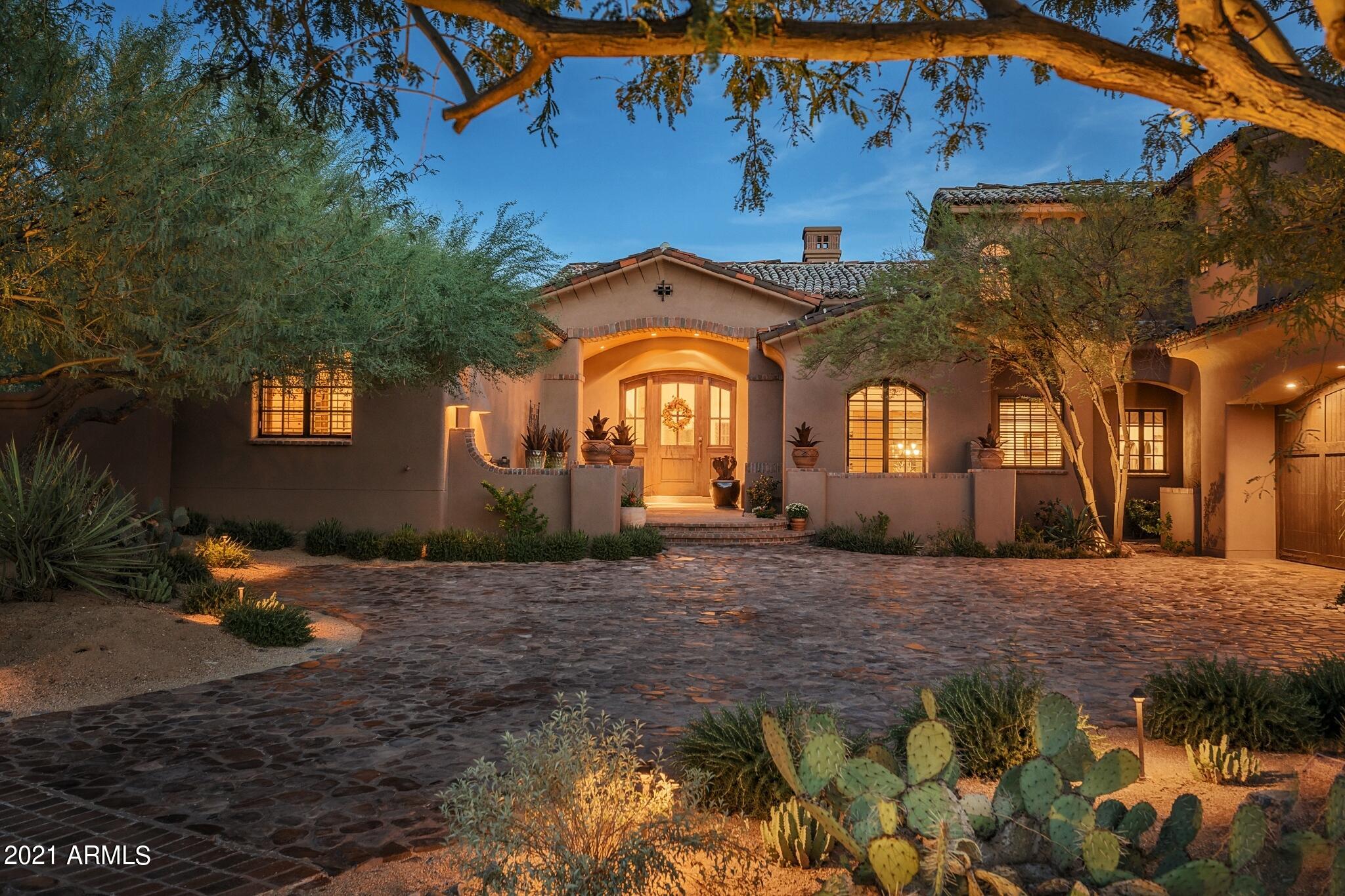 CITY LIGHTS, MCDOWELL MOUNTAIN VIEWS, ON THE GOLF COURSE - one of the best homes in the Country Club at DC Ranch - behind the 24/7 manned guard gate, this home on Cattle Whip, on the 6th tee, is fully equipped, has an award-winning kitchen with wine cellar, and has absolutely stunning views from every single room. Set back from the street with fantastic privacy in both the front + back yards. Canterra and limestone floors, salvaged beams from Pennsylvania, soaring ceilings, new paint inside + out, separate guest house complete with bedroom and private living room, private courtyard and patios... Sparkling pool, spa, fire pit, and grassy area all focus on the towering mountains, and golf course with unobstructed city lights from both levels, even a view of Pinnacle Peak. THIS. IS. THE. ONE.