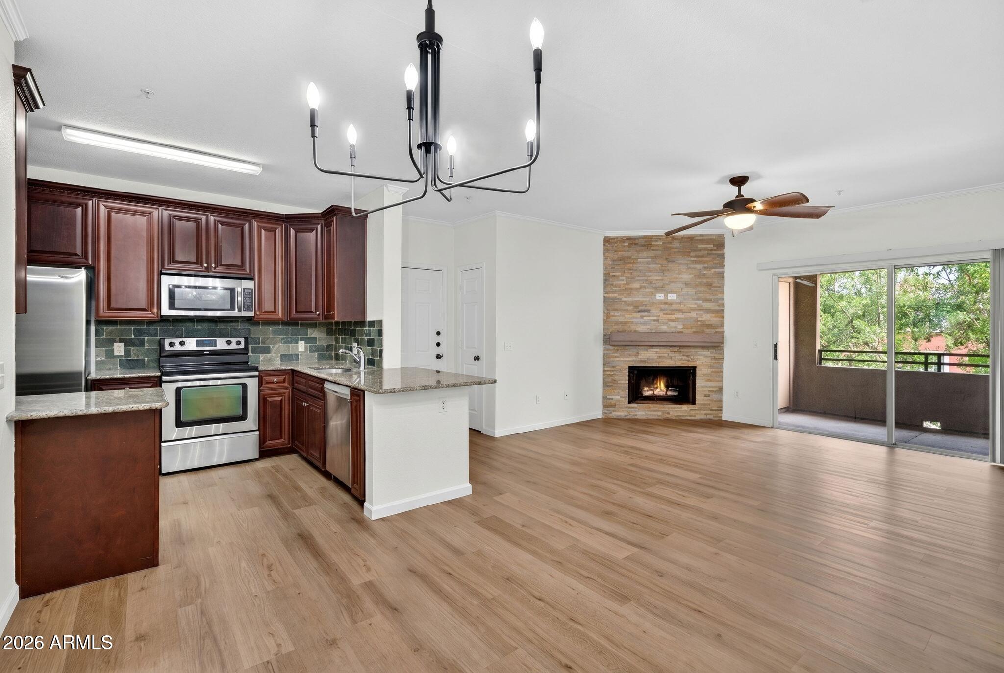 Freshly updated penthouse-level end unit in gated, resort-style Red Rox! This spacious 2BR/2BA offers the largest floor plan at 1,042 SF, abundant natural light, and large walk-in closets in both BRs. Recent updates include fresh interior paint, brand-new wood-look LVP flooring, and new BR carpet. Kitchen and baths feature granite counters and beautiful backsplash details for a clean, move-in-ready feel.  Ideally located and close to all the amentities. Red Rox amenities include 2 sparkling pools, spa, cabanas, lagoon, fountain, fitness ctr, media rm, putting green, BBQ areas, and more. Prime location moments to ASU, Sky Harbor, Papago Park, Phoenix Zoo, Desert Botanical Garden, Downtown Phoenix, Old Town Scottsdale, light rail, Tempe Town Lake, Mill Ave, and Loop 202