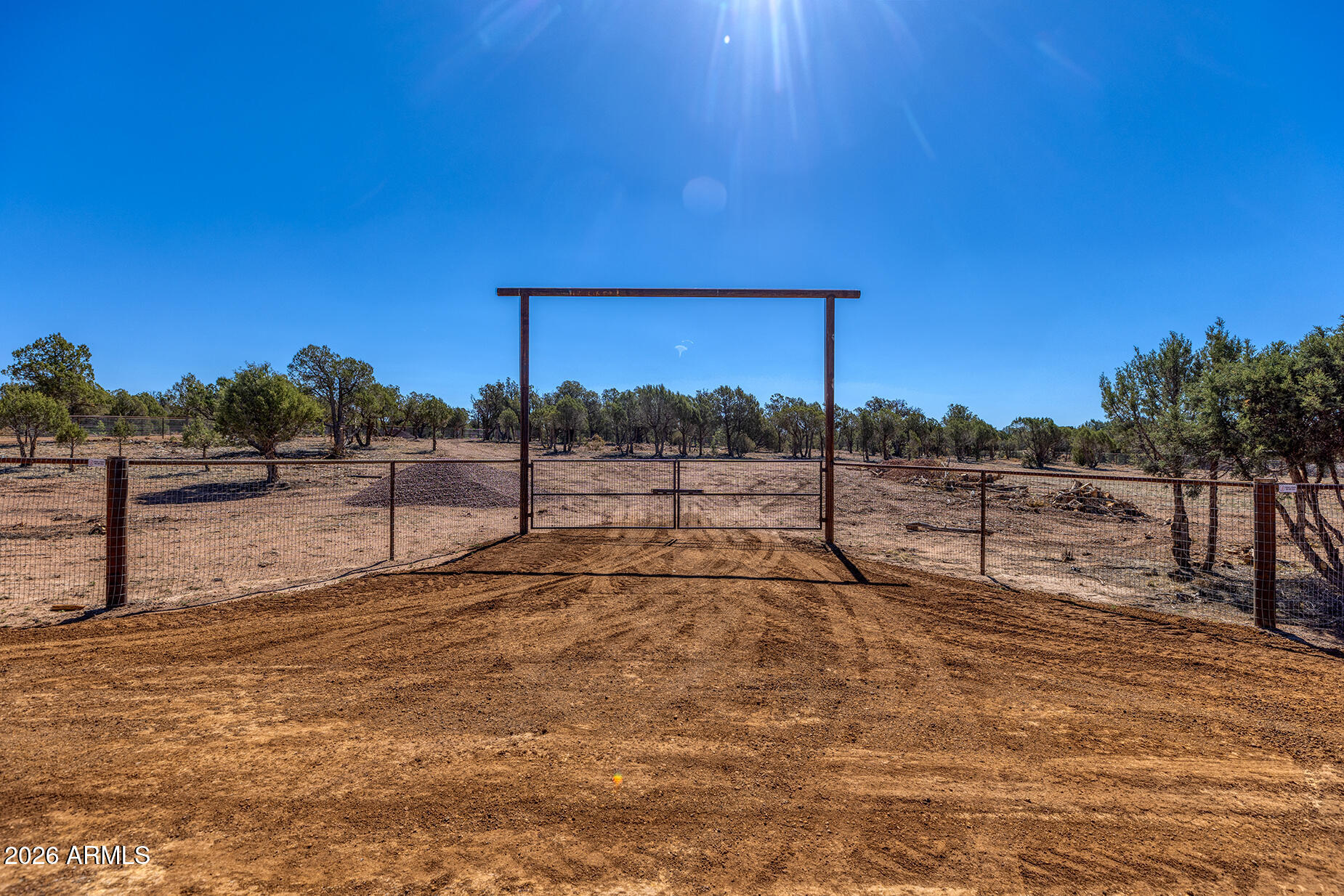 2.51 Acres of Opportunity in Show Low, AZ. Just miles from Linden, this beautiful parcel offers the perfect blend of privacy and convenience. Comes with a brand new private water well (5-year equipment warranty and a passing perc test! Enjoy being steps from the national forest, fully gated with no-climb fencing--perfect for animals & livestock Custom entry gates with extra-wide entrances make RV or trailer access easy. Plus, an equestrian trail runs right behind the property, connecting you directly to the forest! Build your dream home, hobby ranch, or getaway--this land is ready! **Two other lots are also for sale, MLS 7007104 and 7004680**