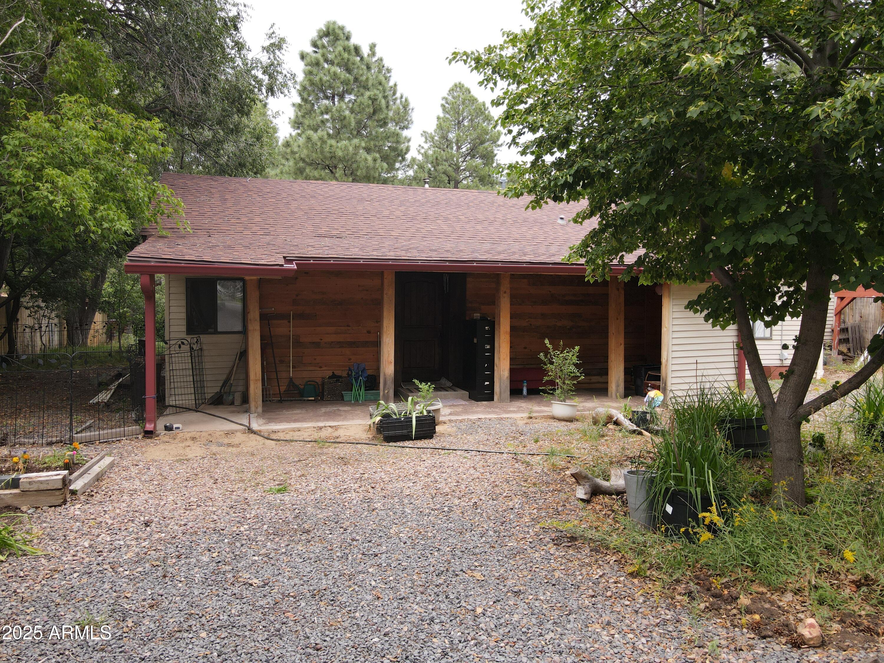 Cabin property tucked in the woods. Beautiful mature trees. Arizona Douglas fir flooring, stone fireplace with pellet stove. This property has its own well for watering the land caping and also has city water. City utilities. The lot is one of a kind, with oak trees, ponderosa pines, juniper, box elder, plumb, catalpa, alligator juniper, ivy and much more. Perfect place to get out of the heat and enjoy the beauty of the white mountains. located 0.26 miles from Rainbow Lake.