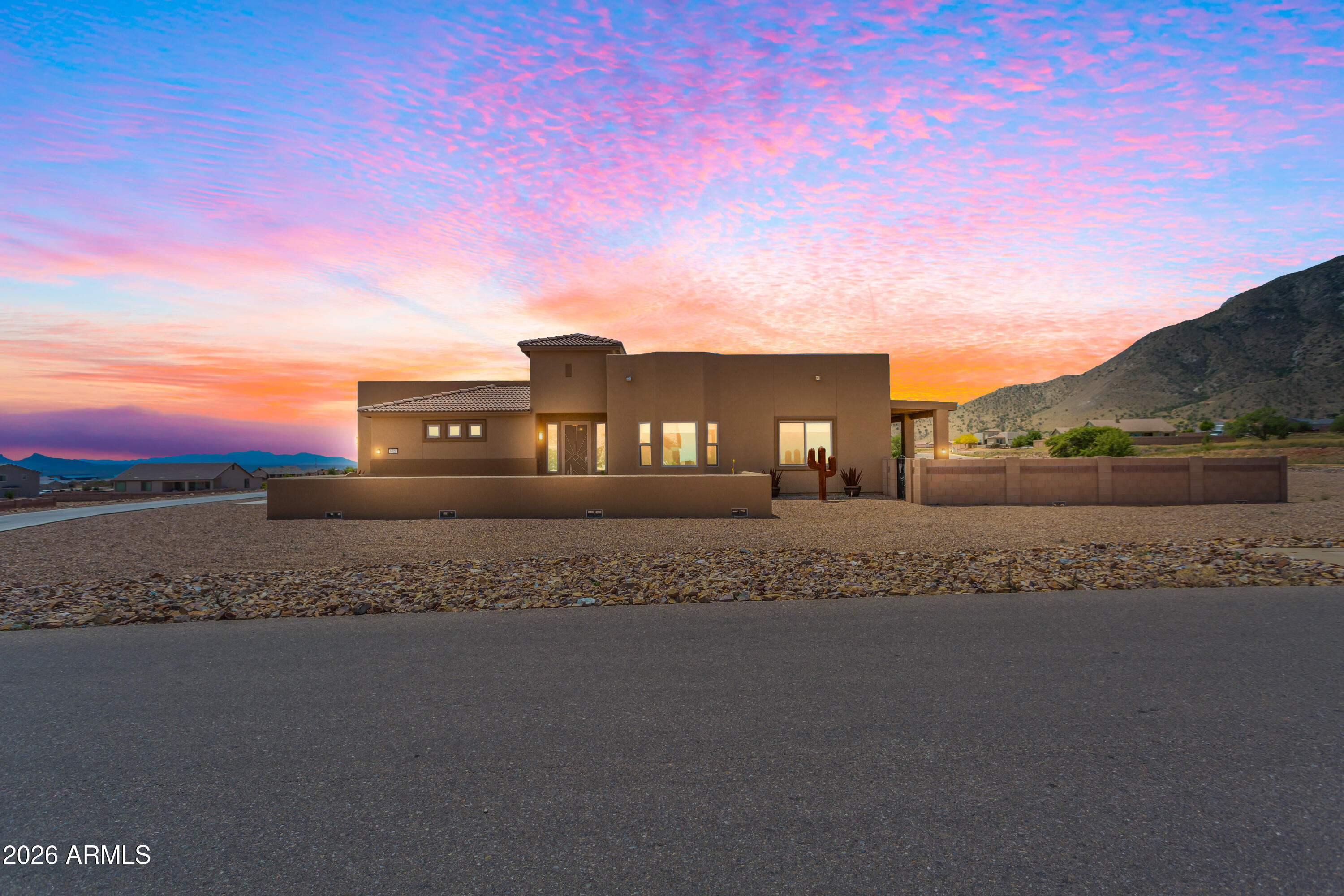 Skip the build wait! This 2021 home on a 1.22-acre corner lot offers stunning 360-degree mountain views.

Highlights:

Interior: Airy open floor plan with 4 bedrooms and 2 designer baths.

Kitchen: 36'' maple cabinetry, quartz countertops, stainless steel appliances (SxS fridge included), and an expansive island.

Upgrades: Ceramic tile throughout (no carpet!), custom automatic blinds, water softener, ceiling fans, Decorative Iron Screen door and gate.

Garage: Insulated 3-car garage with built-in cabinetry and overhead storage. 

Outdoor: Large paved front courtyard and low-maintenance backyard with decorative metal art and passive water capture. Move-in ready with sophisticated finishes and unmatched views.