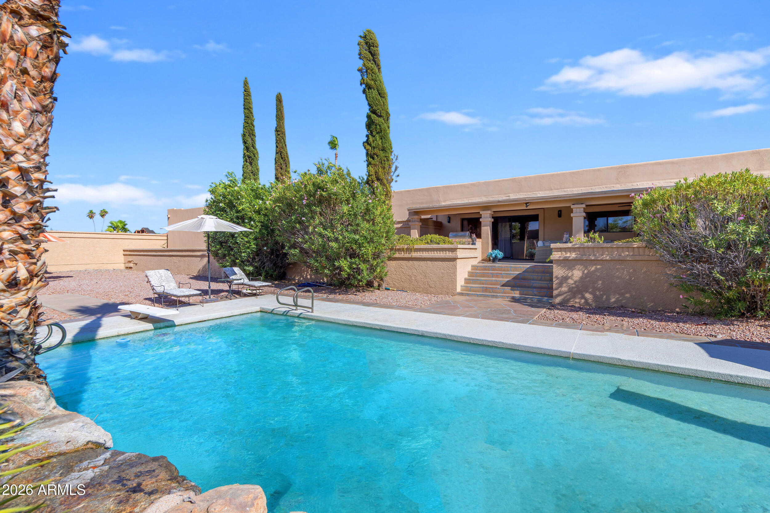 PRICED $55,000 BELOW RECENT APPRAISED VALUE! Nestled on over an acre, this expansive custom home offers nearly 4,800 square feet of living space, exceptional indoor-outdoor entertaining, and one of the best values currently available in Fountain Hills.

Featuring 4 bedrooms, 4 bathrooms, and a 2-car garage, the thoughtfully designed floor plan offers multiple living and entertaining spaces, abundant natural light, and the flexibility to accommodate guests, multigenerational living, or a work-from-home lifestyle.

The home's standout entertainment room features a full bar and provides the perfect setting for holiday gatherings, celebrations, game days, and special events. Multiple gathering spaces throughout the home make entertaining effortless.

Step down to your private backyard retreat featuring a sparkling pool, outdoor showers, built-in BBQ grill, extensive covered patio space, and stunning mountain views. The expansive outdoor living areas are ideal for dining, relaxing, and entertaining year-round while enjoying the beauty and privacy of this oversized lot.

PRICED BELOW APPRAISED VALUE " OVER AN ACRE " NEARLY 4,800 SQ FT " FULL BAR " BUILT-IN BBQ " POOL " OUTDOOR SHOWERS " EXPANSIVE COVERED PATIOS " MOUNTAIN VIEWS

A rare combination of space, views, privacy, and value in the heart of Fountain Hills.