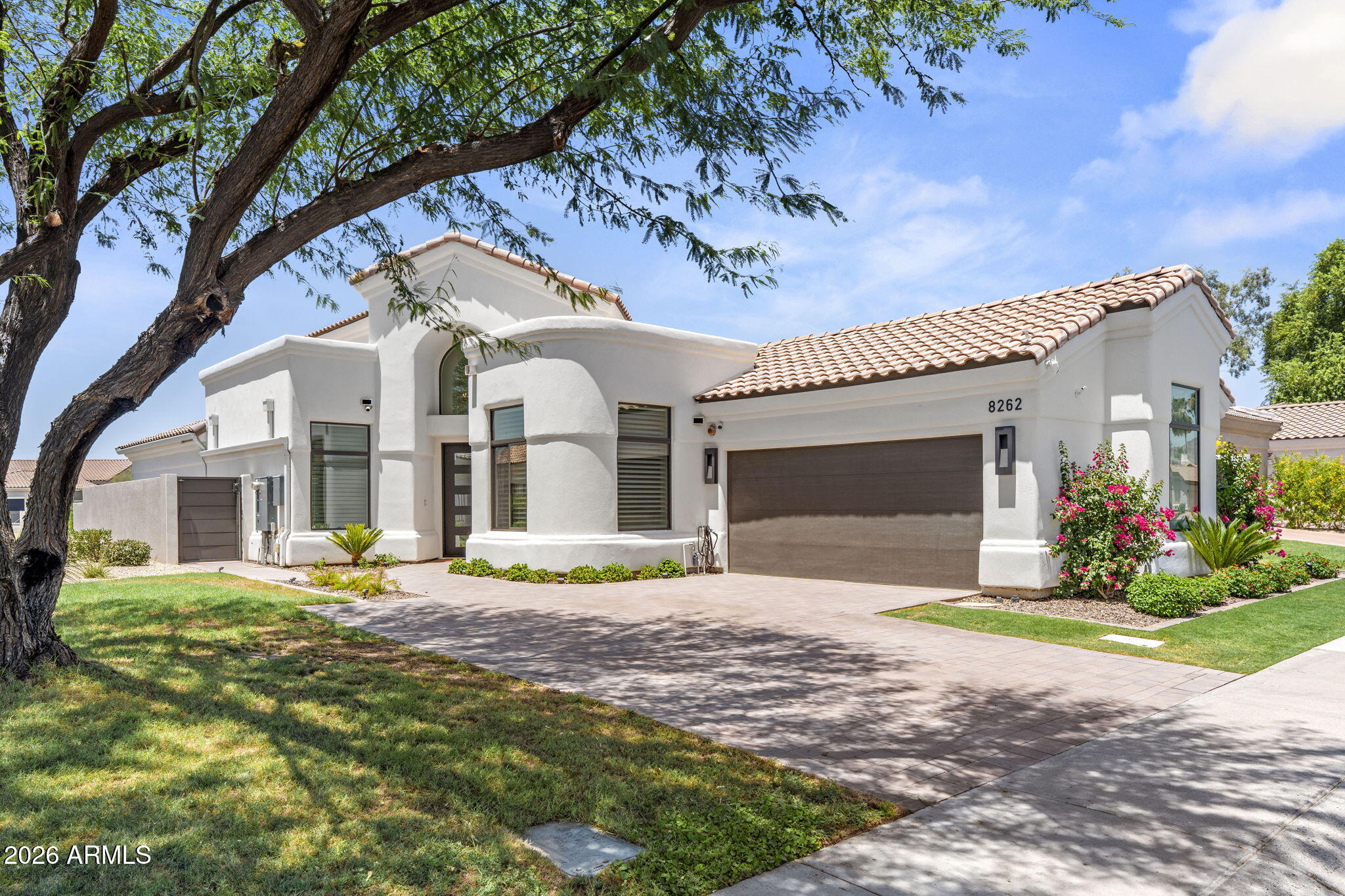 Rare opportunity in guard-gated Scottsdale Country Club, one of Scottsdale's most sought after communities. This FULLY RENOVATED 4BD/3.5BA offers a golf course & waterfront view. NO rear neighbors. All furnishings to convey. Rebuilt from the studs up with NEW electrical, NEW plumbing, two AC units, and new windows. Custom cabinetry, real hardwood floors, quartzite counters, and designer lighting, Sub-Zero and Wolf appliances, remote controlled window coverings. Backyard features a heated pool with waterfall, outdoor shower, spa, & built-in BBQ with refrigerator, set against unobstructed golf course and water views. Garage includes a mini split for year round comfort. Amenities include Guard Gated Services, Tennis/Pickleball courts, weekly front yard landscape maintenance. 3 C's Schools!