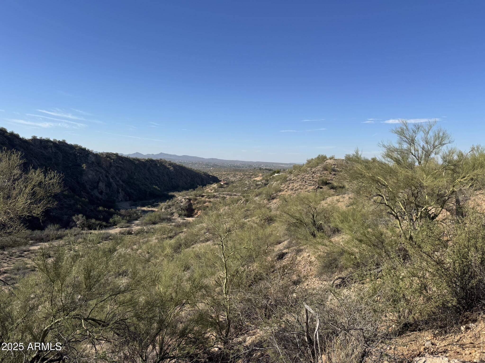 Discover the perfect canvas for your dream home on this stunning 10-acre parcel of raw Arizona desert. Located just outside Wickenburg, this property offers panoramic views of the surrounding mountains, breathtaking sunrises and sunsets, and the peaceful desert lifestyle so many seek. With electricity nearby and an existing building pad, much of the groundwork is set for your future build. Whether you're envisioning a custom ranch home, winter retreat, or a quiet full-time residence, this property provides endless possibilities. Surrounded by beautiful custom homes and wide-open space, the area is prized for its privacy, natural beauty, and access to the outdoors. Ride straight out into the desert, explore endless trails, or enjoy quiet evenings under star-filled skies. A rare opportunity to own 10 acres in one of Wickenburg's most scenic locations - your dream home starts here!