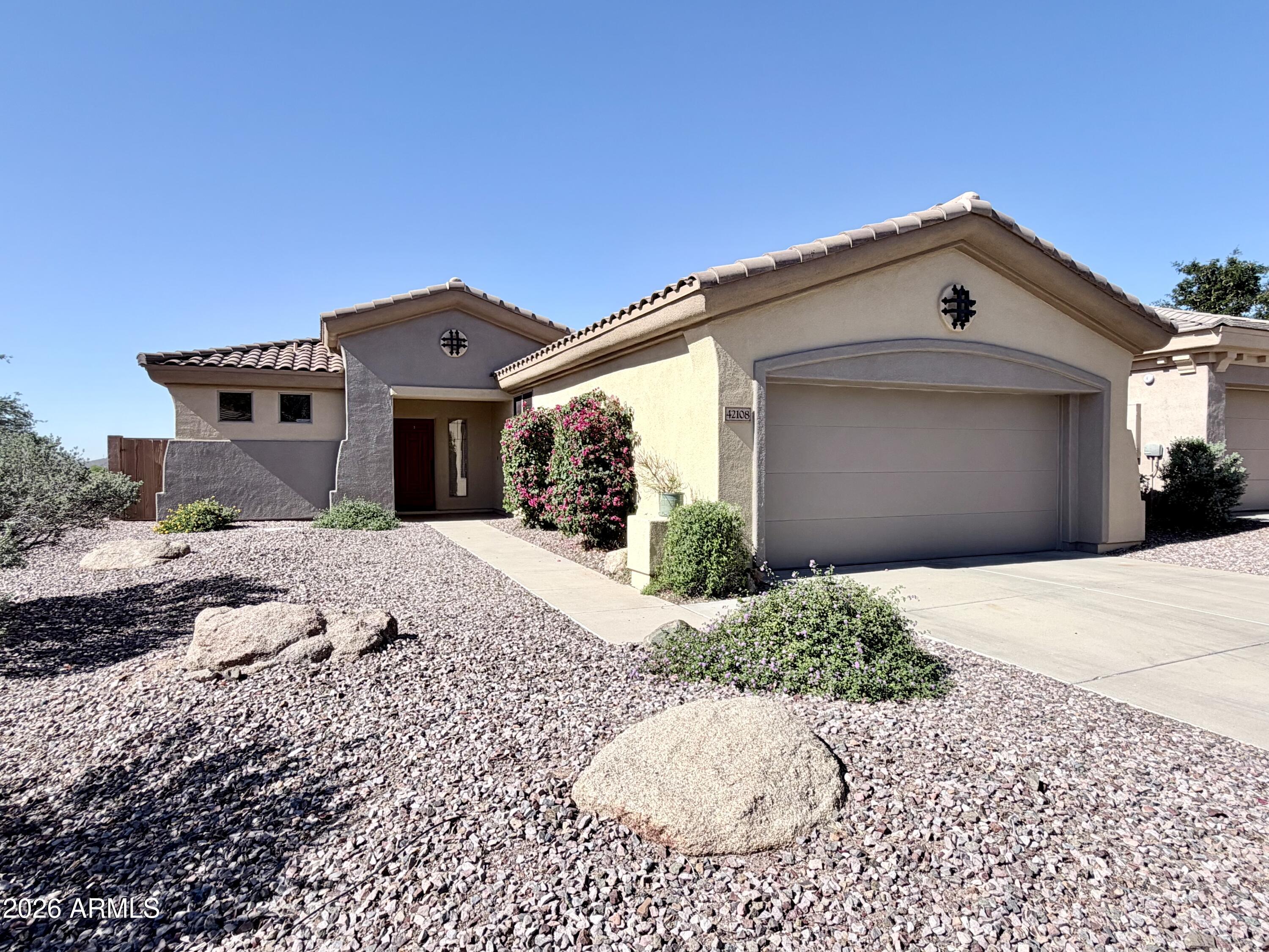 Wonderful Anthem Country Club home for sale, located just above the Persimmon Country Club. Nestled on an elevated lot with desert views, this home backs to a lush common area with open space on the back and side. The open-concept kitchen flows into a spacious great room, perfect for entertaining, with large windows framing scenic vistas.  Enjoy Anthem's vibrant community and world-class amenities, including golf, pools, and fitness centers.  Ideal for those seeking elegance and relaxation.This is the Dover Model with the extended length Master Bedroom and Family room.