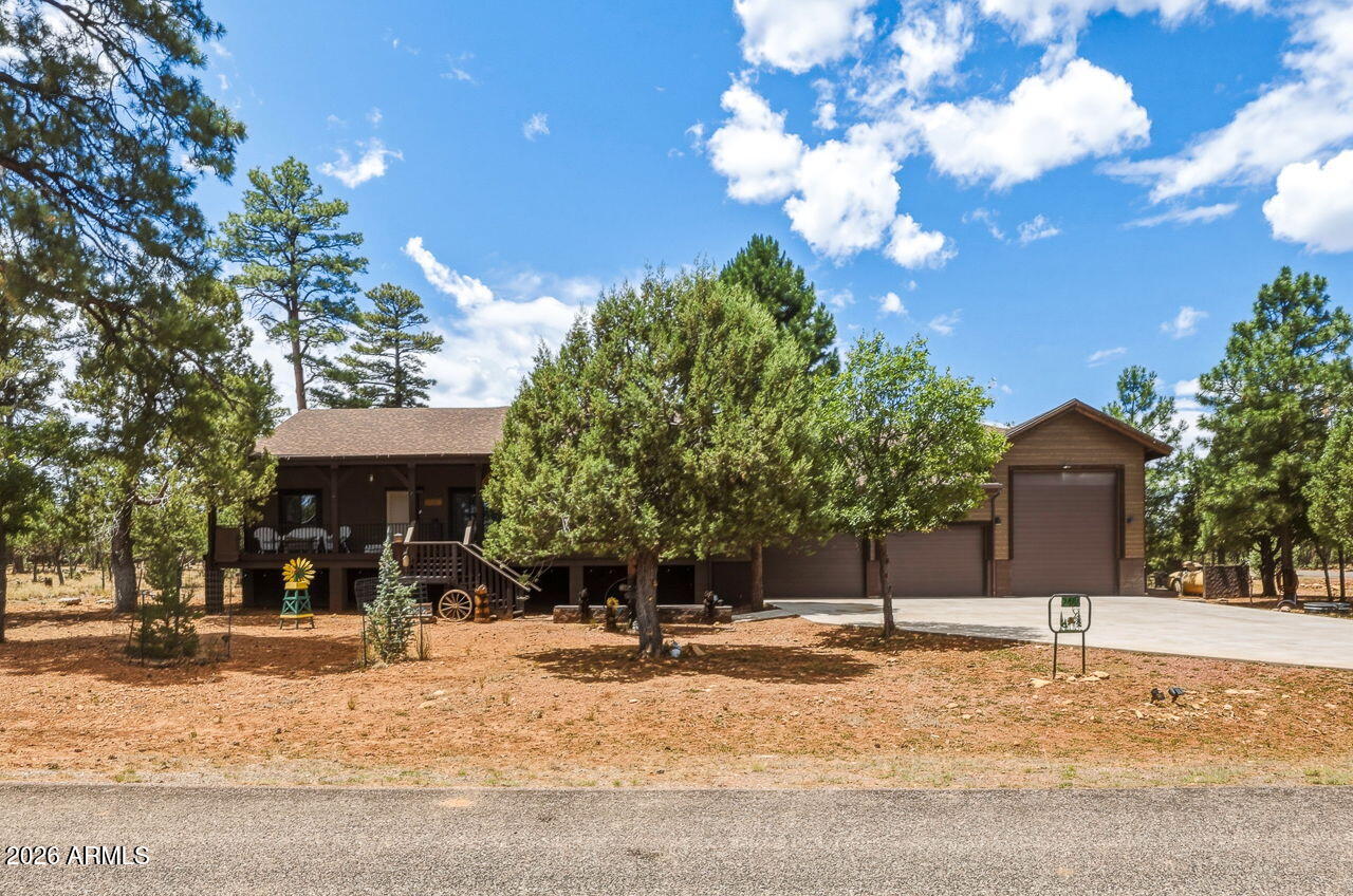 Exquisite Custom Home Built in 2022 with a RV Garage sitting on .70 of an acre, Surrounded in Tall Ponderosa Pines. Come be the 2nd Owner of this Captivating 1955 sq ft SINGLE Story Split 3bd/2bth Tucked Peacefully in the Serene Beauty of Mountain Living at its Finest!
This Residence also has an ADDITIONAL 2,073 Sq Ft Garage w/ a Lift and Heat! Plus, a closed in 30x11 Livable Loft with a Split Unit available for Year-Round Use.

From the Moment You Step Inside, You're Greeted with T&G, Natural Light Throughout, a Gourmet Kitchen with Ample Cabinets, Granite Countertops, Wood Flooring, and Soaring Vaulted Ceiling surrounding the Cozy Fireplace Covered in Real Stone. Whether you're wanting a Lock & Leave Year-Round Family Retreat, a Potential Rental Investment or Full Time Living the Seller's spared NO EXPENSES Top to Bottom when Designing the Home. See Documents Attached for Full List of Upgrades. Extra Bonus Features include a Fully Owned Solar System, Option to have Fireplace as Gas OR Wood, Home has ALL Solid Wood Doors, Security Cameras Inside and Outside, 6ft Thick Concrete Driveway Reinforced with Steel Mesh & 3500 lb Concrete & Fiberglass, Gas Hook Ups available under Back Porch, Gutters with Leaf Guards and Underground Drains in the Front & Back to pull any Access Water Away from Home, Planters Garden, Insulated Garage Doors, RV Epoxy Flooring, Extra Storage for Workshop or more Toys, Crawl Space in Garage with access to Plumbing, Tankless Hot Water Heater, Furnace, Press Pump/Tank to control water pressure, lots of space for storage and easy to walk around in, the list goes on! However, there is still room for your own personal touches like an Outdoor Kitchen/Grilling Area, Jacuzzi, Greenhouse, etc.

From its Stunning Design & Modern Upgrades to its Energy Efficiency & Private Setting, this is a One-of-a-Kind Opportunity to Own a Piece of Luxury in Happy Jack with the potential of coming Fully Furnished. Enjoy the Large Outdoor Decks for Arizona's Gorgeous Sunsets, Star Gazing or your Morning coffee with Mountain Views and Wildlife passing by.

Just a Short drive to Pine/Strawberry, Camp Verde or Winslow where You'll have Access to Local Shops, Dining, all your Entertainment needs! So, bring your Toys and explore all the Trails, Lakes and the National Forest in the cooler parts of Northern Arizona that Mogollon Rim has to offer!