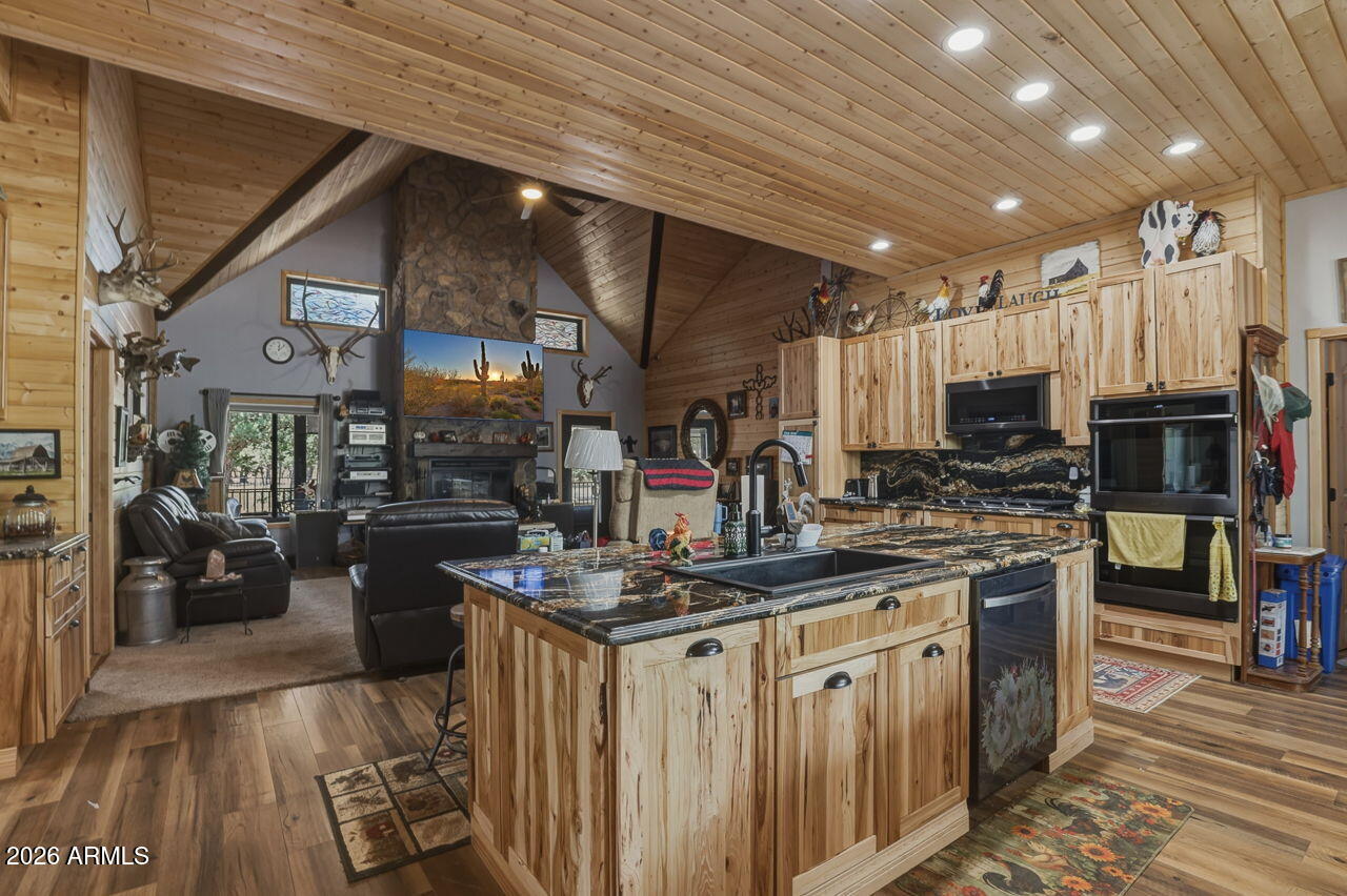 Exquisite Custom Home Built in 2022 with a RV Garage sitting on .70 of an acre, Surrounded in Tall Ponderosa Pines. Come be the 2nd Owner of this Captivating 1955 sq ft SINGLE Story Split 3bd/2bth Tucked Peacefully in the Serene Beauty of Mountain Living at its Finest!
This Residence also has an ADDITIONAL 2,073 Sq Ft Garage w/ a Lift and Heat! 

From the Moment You Step Inside, You're Greeted with T&G, Natural Light Throughout, a Gourmet Kitchen with Ample Cabinets, Granite Countertops, Wood Flooring, and Soaring Vaulted Ceiling surrounding the Cozy Fireplace Covered in Real Stone. Whether you're wanting a Lock & Leave Year-Round Family Retreat, a Potential Rental Investment or Full Time Living the Seller's spared NO EXPENSES Top to Bottom when Designing the Home. See Documents Attached for Full List of Upgrades. Extra Bonus Features include a Fully Owned Solar System, Option to have Fireplace as Gas OR Wood, Home has ALL Solid Wood Doors, Security Cameras Inside and Outside, 6ft Thick Concrete Driveway Reinforced with Steel Mesh & 3500 lb Concrete & Fiberglass, Gas Hook Ups available under Back Porch, Gutters with Leaf Guards and Underground Drains in the Front & Back to pull any Access Water Away from Home, Planters Garden, Insulated Garage Doors, RV Epoxy Flooring, Extra Storage for Workshop or more Toys, Crawl Space in Garage with access to Plumbing, Tankless Hot Water Heater, Furnace, Press Pump/Tank to control water pressure, lots of space for storage and easy to walk around in, the list goes on! However, there is still room for your own personal touches like an Outdoor Kitchen/Grilling Area, Jacuzzi, Greenhouse, etc.

From its Stunning Design & Modern Upgrades to its Energy Efficiency & Private Setting, this is a One-of-a-Kind Opportunity to Own a Piece of Luxury in Happy Jack with the potential of coming Fully Furnished. Enjoy the Large Outdoor Decks for Arizona's Gorgeous Sunsets, Star Gazing or your Morning coffee with Mountain Views and Wildlife passing by.

Just a Short drive to Pine/Strawberry, Camp Verde or Winslow where You'll have Access to Local Shops, Dining, all your Entertainment needs! So, bring your Toys and explore all the Trails, Lakes and the National Forest in the cooler parts of Northern Arizona that Mogollon Rim has to offer!
