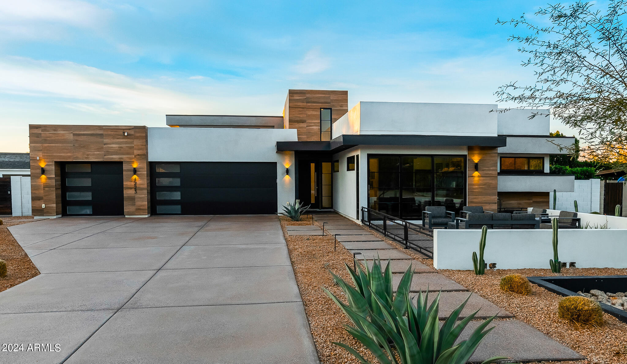 Stunning 2021 build by Blue Sky Homes LUXE division. Nestled between Arcadia and Paradise Valley, this contemporary 4,072 sq ft residence features 4 beds, 4.5 baths, with a large office/game room and 3-car garage. Abundant natural light, a spacious living area with 16 ft ceilings, and an open-concept gourmet kitchen complete with Sub-Zero and Wolf appliances. Private owner's suite with spa-like bathroom and two large closets. Generously sized bedrooms with multiple en-suite bathrooms and spacious walk-in closets. Lovely views of Camelback Mountain, including Praying Monk, from the backyard. Enjoy Arizona weather year-round from multiple indoor/outdoor living spaces including an outdoor kitchen and a pergola with electric trellis and sunshades. Large saltwater pool with attached spa...... Energy Star certified (50% more energy efficient than similar sized new build).

Walking distance to the finest shopping, dining, and hotel establishments including The Henry, Steak 44, PYRO, and the Hot Global Ambassador. Just Minutes from Fashion Square Mall, Paradise Valley, The Biltmore. A 7-minute drive to Phoenix Sky Harbor. Conveniently located Phoenix Country Day School, the Hopi School District, and all that Arcadia Living has to offer.