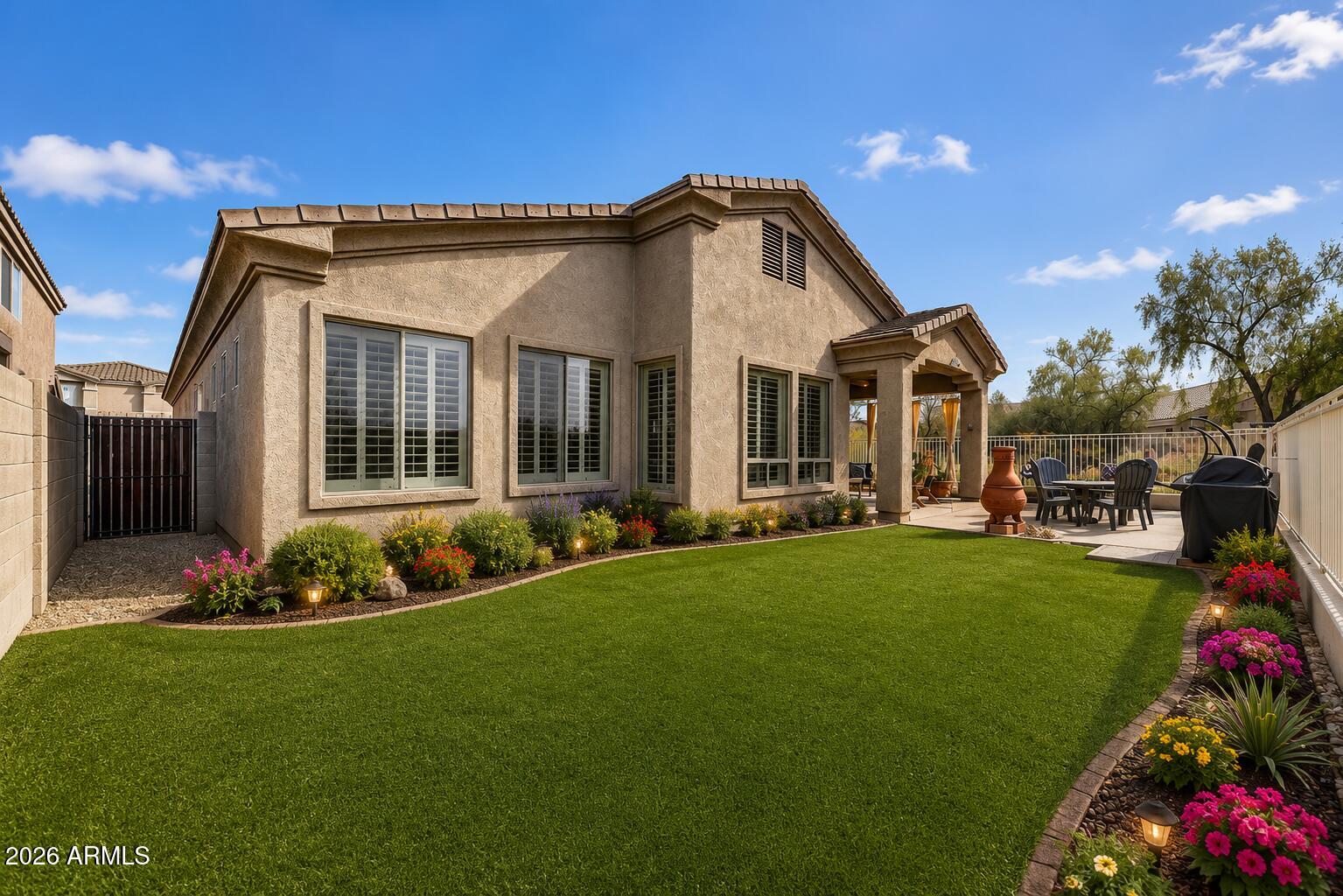 Welcome to this impeccably maintained home in the prestigious gated community of Dove Valley Ranch! From the moment you step inside, you'll be greeted by a warm and inviting atmosphere, complemented by bright, open spaces that offer endless possibilities to suit your lifestyle. The gourmet kitchen is a true entertainer's delight, featuring an expansive island, abundant cabinet storage, and a dedicated coffee and refreshment area. The spacious master suite overlooks the serene natural landscape, providing breathtaking sunrises and sunsets right from your window. Step outside into a tranquil backyard oasis, where nature and privacy blend seamlessly to create the perfect retreat.