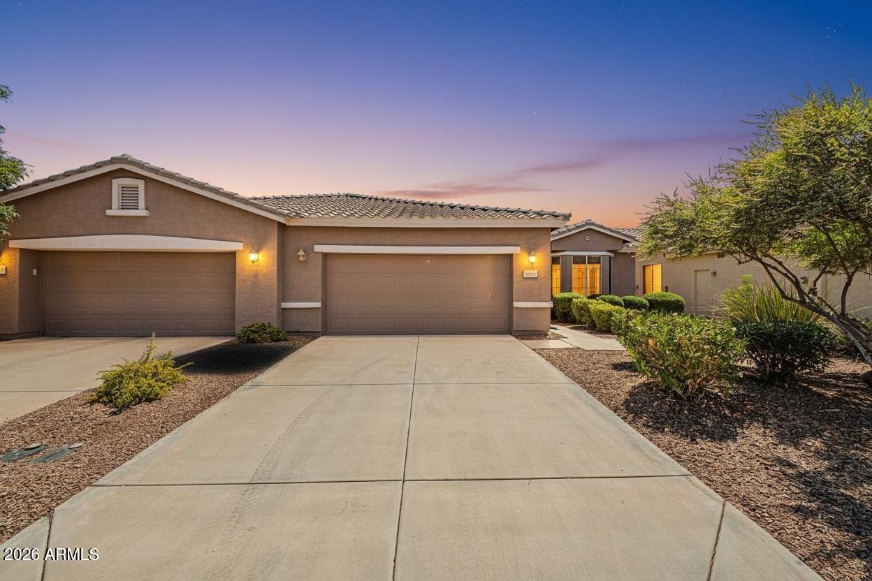 Beautifully maintained home in a desirable 55+ gated community in Maricopa! Ideally situated on a premium lot backing to an HOA-maintained greenbelt, this property offers added privacy and peaceful, open views with no rear fence interruption. Inside, enjoy updated flooring and a refreshed kitchen featuring modern finishes and a functional layout perfect for everyday living and entertaining. The light-filled interior creates a warm, inviting atmosphere throughout. Step outside to a serene backyard setting, ideal for relaxing or enjoying Arizona evenings. Community amenities, gated security, and convenient access to shopping and dining complete this exceptional home.