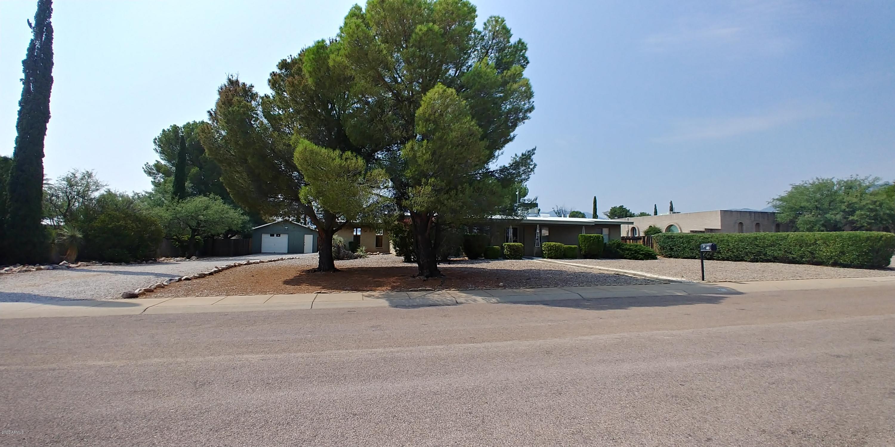 This is a great opportunity to purchase an amazing home at a great price. This home has laminate and ceramic tile in most of the home except the bedrooms and there is carpet there. There is travertine in the baths. There is a formal living and dining and room as well as a family room with a real fireplace that you will love this winter. You will love the inground pool that has security fencing! Outside also there is a 2 car carport attached to the house as well as a detached 1 car garage plus workshop area. Any repairs desired would be added to the sales price. This home is priced to sell in its AS IS condition.