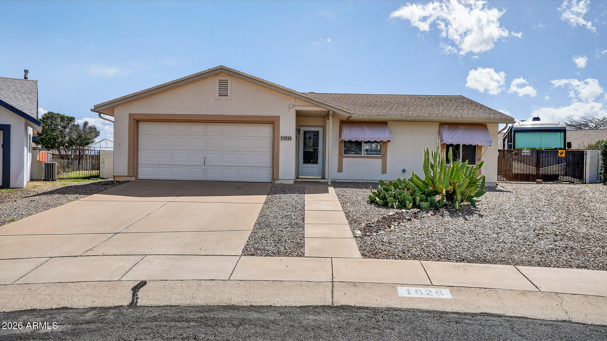 BRAND NEW ROOF!!  Spacious 3 bedroom, 2 bath home offering 1,601 sq ft of living space on a quiet cul-de-sac lot. This well-maintained property features a cozy fireplace, ceramic tile and carpet throughout, PLUS a brand-new roof. The kitchen includes hard-surface countertops, gas stove, microwave, and refrigerator. Washer and dryer are included for added convenience. Enjoy outdoor living under the large covered patio while taking in the privacy of a lot that backs to a wash--no neighbors behind you. RV parking with hookups provides plenty of space for your toys. Great combination of comfort, privacy, and functionality.