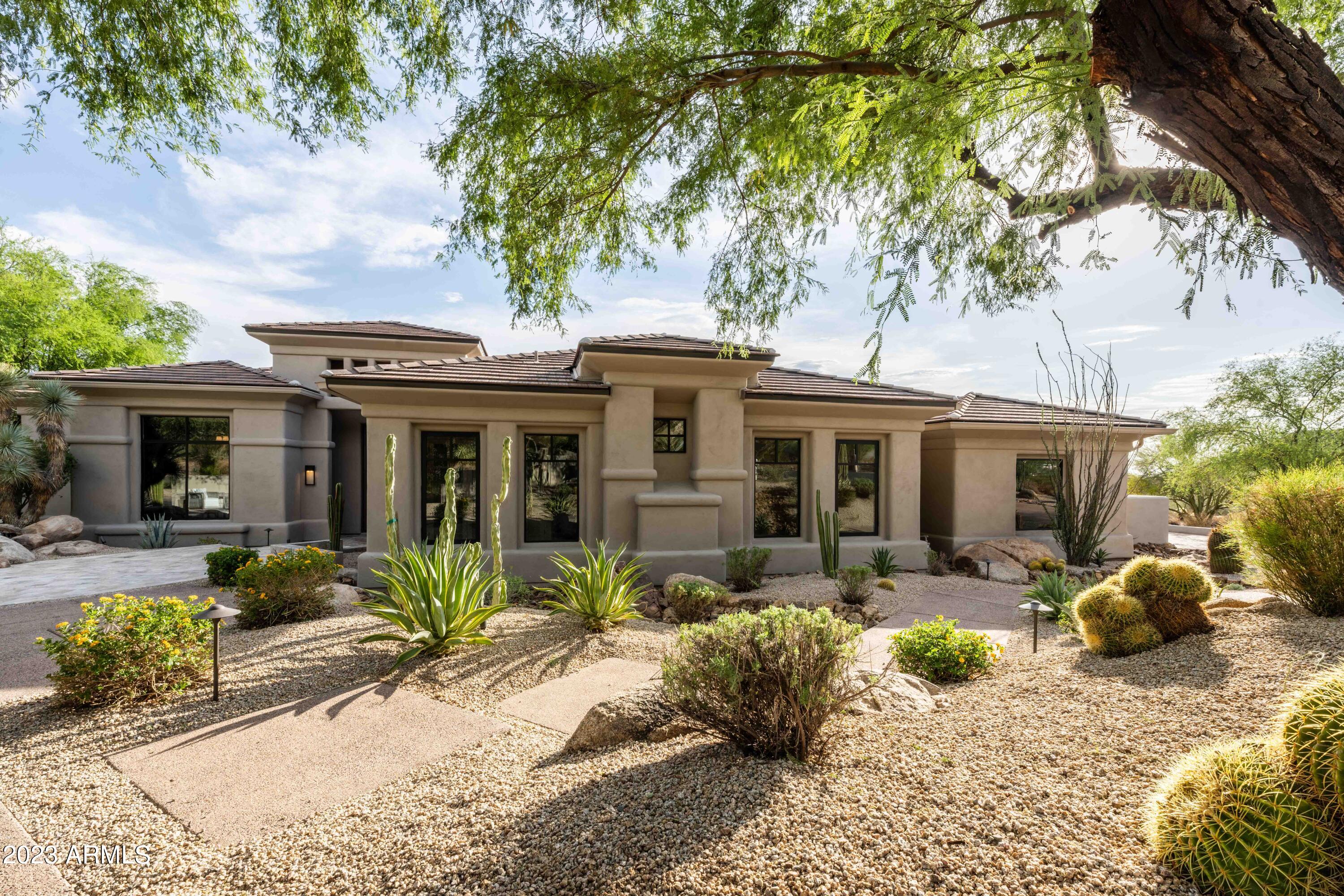 Ricci Renovations is ready to reveal another gem! Prized Penstamin has it all, a complete restoration of this estate in the highly sought after guard gated neighborhood of The Retreat at One Hundred Hills. As usual, nothing has been overlooked. European oak wood floors throughout, carefully selected tile in each bath, custom cabinetry in a mix of Rift Oak & Supramat finishes alongside gorgeous quartz & quartzite countertops. The kitchen is extraordinary w/ waterfalled island & Thermador panel ready appliance package. A walk-in dual access temp-controlled wine cellar is ideally situated between the wet bar & dining room. The living room features an automated pocket slider & wall to wall custom tile around a 72'' linear fireplace. Floating cabinetry, wallpapered TV wall & and new 16' x 10' slider make the family room a gathering hotspot. The primary suite boasts 13' ship lapped ceilings, 10' slider to backyard, & an attached exercise/multipurpose room. A redesigned primary bath now showcases an incredible shower wrapped in marble, wall mounted Luxe Gold faucets/hardware & a tub room w/ a glass tiled wall that exudes relaxation. Let's not forget about the black & white powder room w/ the dazzling Panda marble/granite and striking custom millwork on the accent wall in the home office that'll wow all onlookers. Separated by a barnyard door, the guest wing features 3 bedrooms & 2 baths, each with its own unique tile. The attached casita is ideal, featuring a pool bath w/ shower, huge game room w/ wet bar & raised covered patio, as well as an oversized bedroom w/ ensuite bath. 
Views are stunning throughout, especially in the backyard, and the multi-entertaining spaces have been transformed. Adorned in Silver Storm travertine, the expansive deck flows throughout & wraps around the newly pebbled & waterline tiled pool/spa. A BBQ station, firepit, large turf area & automated shade provide lots of options for outdoor fun or to simply take in the incredible sunsets & full view of Camelback Mountain w/ city lights.
Designer lighting, hardware & plumbing fixtures were all carefully selected. 2020 HVAC system (5) including garage. 2023 roof underlayment w/ 30-year warranty. 2023 water heaters x 3. Some remodels are lipstick while others are done right. Ask around, the reputation is impeccable.