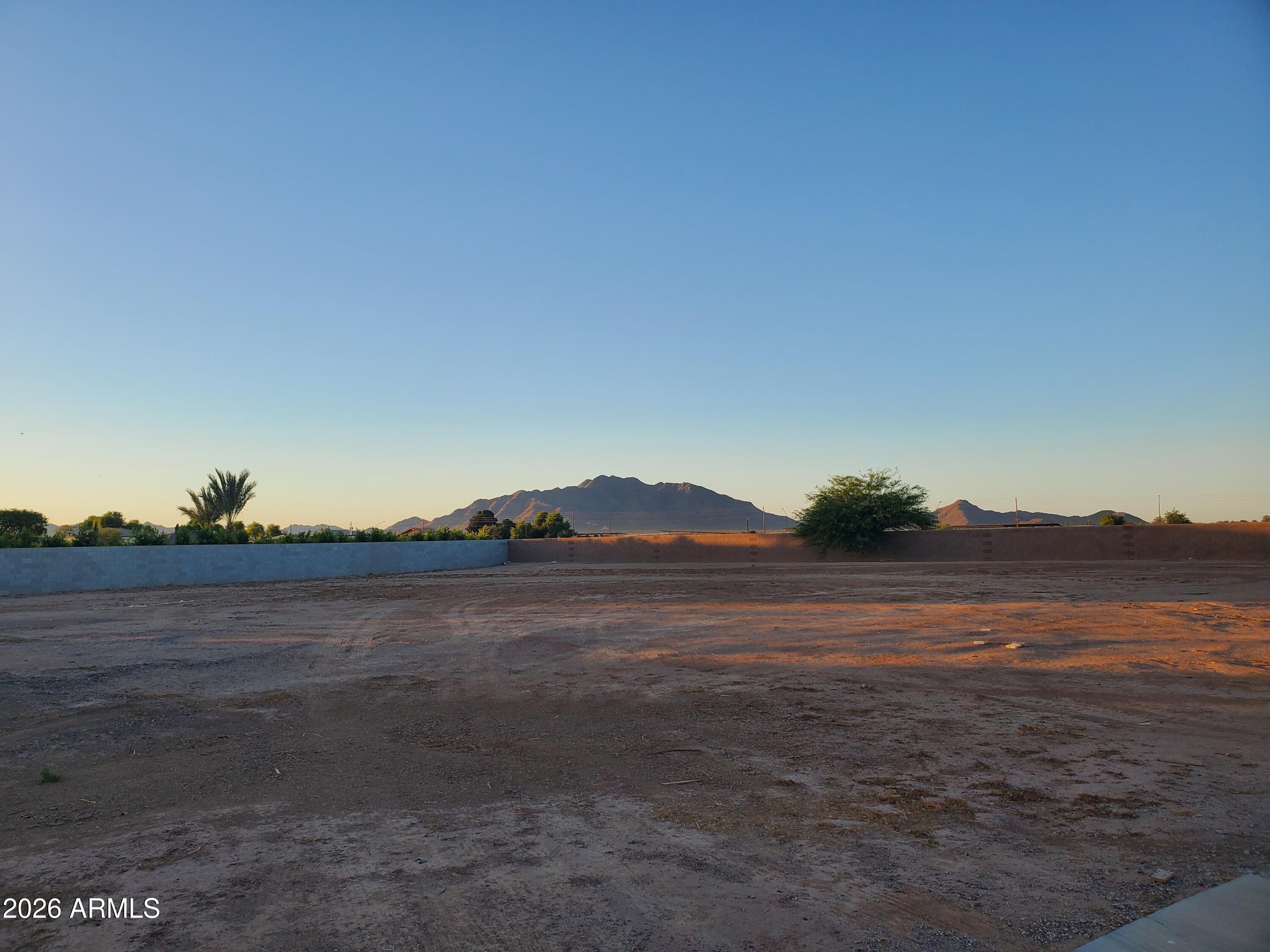 This is an exceptional opportunity: a one-of-a-kind lot featuring stunning views of the San Tan Mountains. Located in the exclusive gated community of HHB Heights in Gilbert, this property is currently shovel-ready, with permits prepared to be pulled through the Town of Gilbert. 

Complete contemporary custom home plans and interior design documents are available to further streamline the process. Utilizing these pre-approved plans would allow a client to save over a year of design work and HOA approval timelines, significantly accelerating the build process.